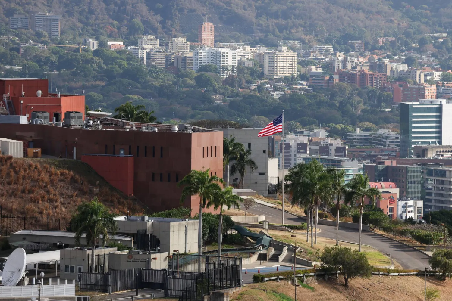 The US flag flies at the former US embassy now housing the Venezuela Affairs Unit (VAU), as the United States and interim authorities in Venezuela agreed to re-establish diplomatic and consular relations, following Nicolas Maduro’s capture, in Caracas, Venezuela March 14, 2026. REUTERS/Leonardo Fernandez Viloria