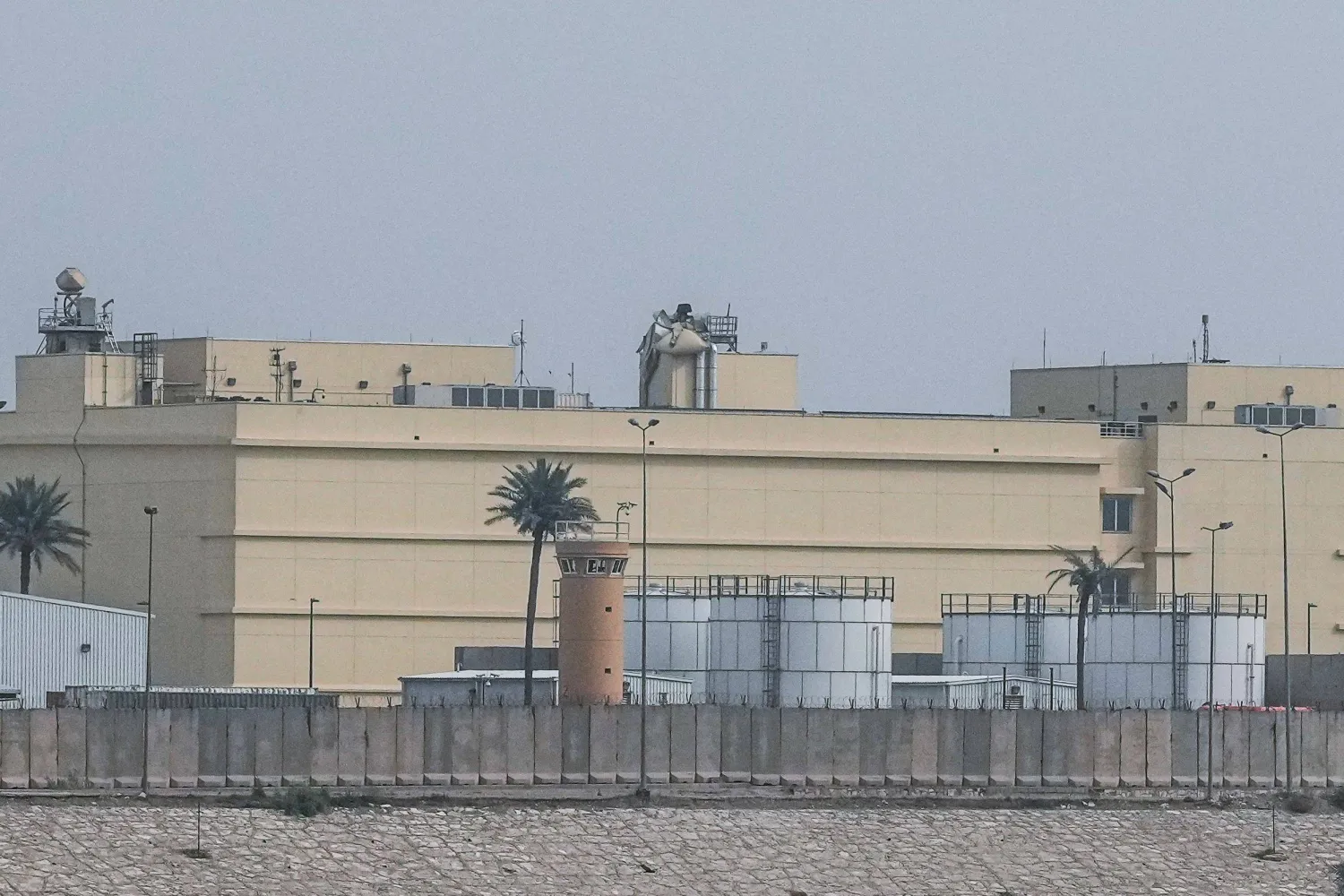 A photograph shows the damage following a reported drone strike on the US embassy in Baghdad's fortified "Green Zone" on March 14, 2026. (Photo by Murtadha RIDHA / AFP)