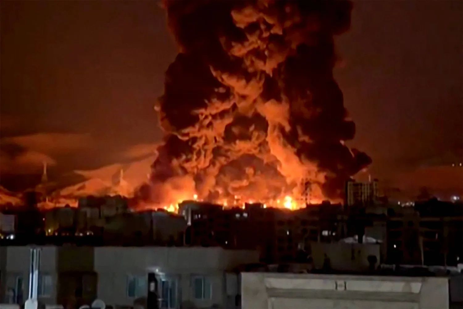 This video grab taken from UGC images posted on social media on March 7 and 8, 2026 shows fire erupting at an oil depot in Iran's capital Tehran. (UGC / AFP)