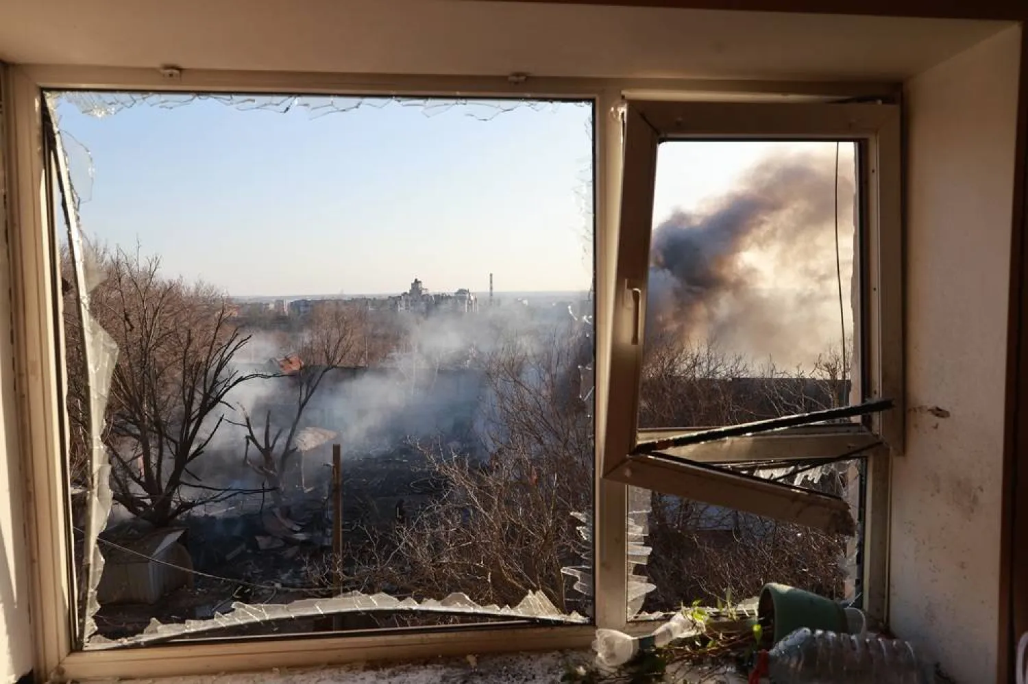  Smoke is seen through the broken window of a residential neighborhood damaged by Russian aerial guided bomb in Zaporizhzhia, Ukraine, Saturday, March 14, 2026. (AP)