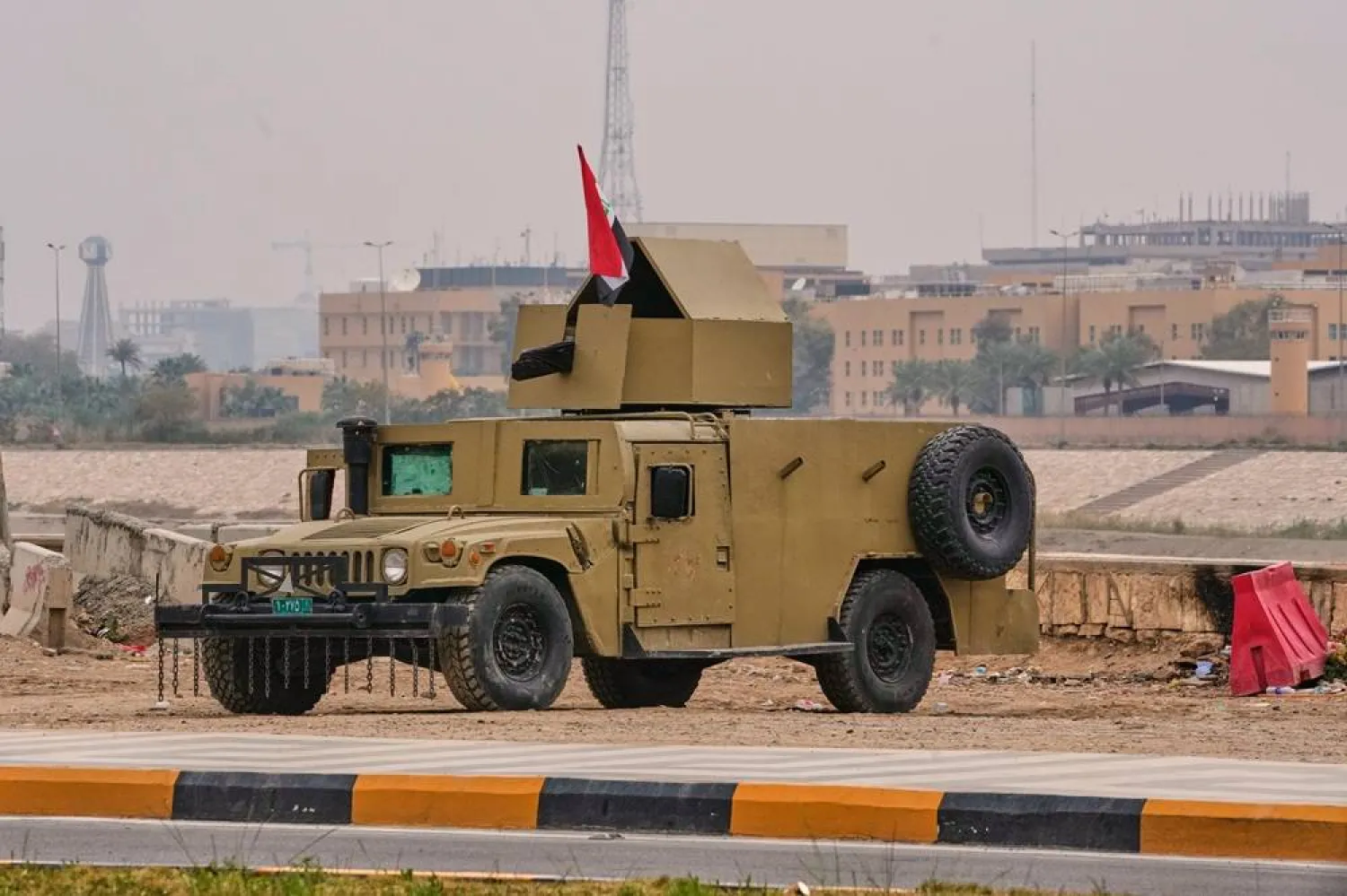 An Iraqi army armored humvee vehicle is deployed near the banks of the Tigris River to protect the US Embassy fortified "Green Zone" in Baghdad, Saturday, March 14, 2026. (AP) 