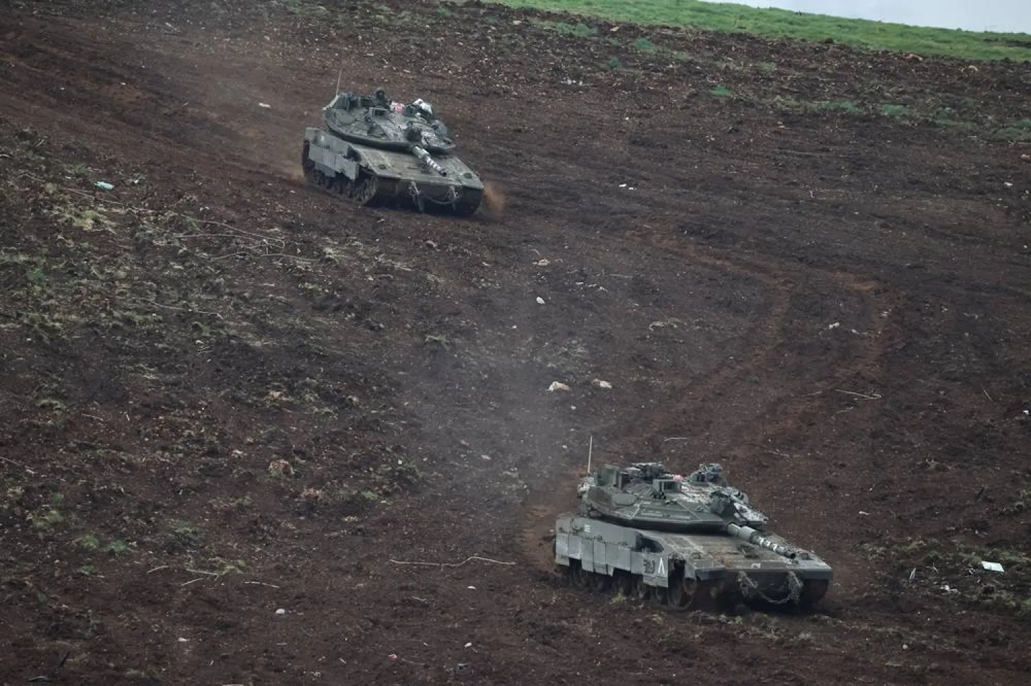  Israeli tanks maneuver on the Israeli side of the Israel-Lebanon border, amid escalation between Hezbollah and Israel, and amid the US-Israeli conflict with Iran, in northern Israel, March 15, 2026. (Reuters)