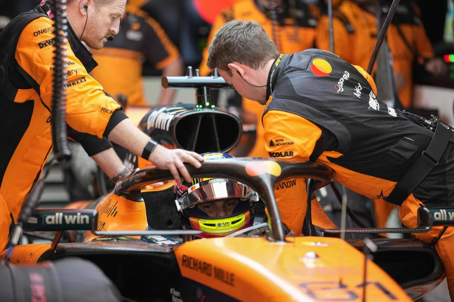 Mechanics work on the car of McLaren's Australian driver Oscar Piastri during the Formula One Chinese Grand Prix at the Shanghai International Circuit in Shanghai on March 15, 2026. (AFP)