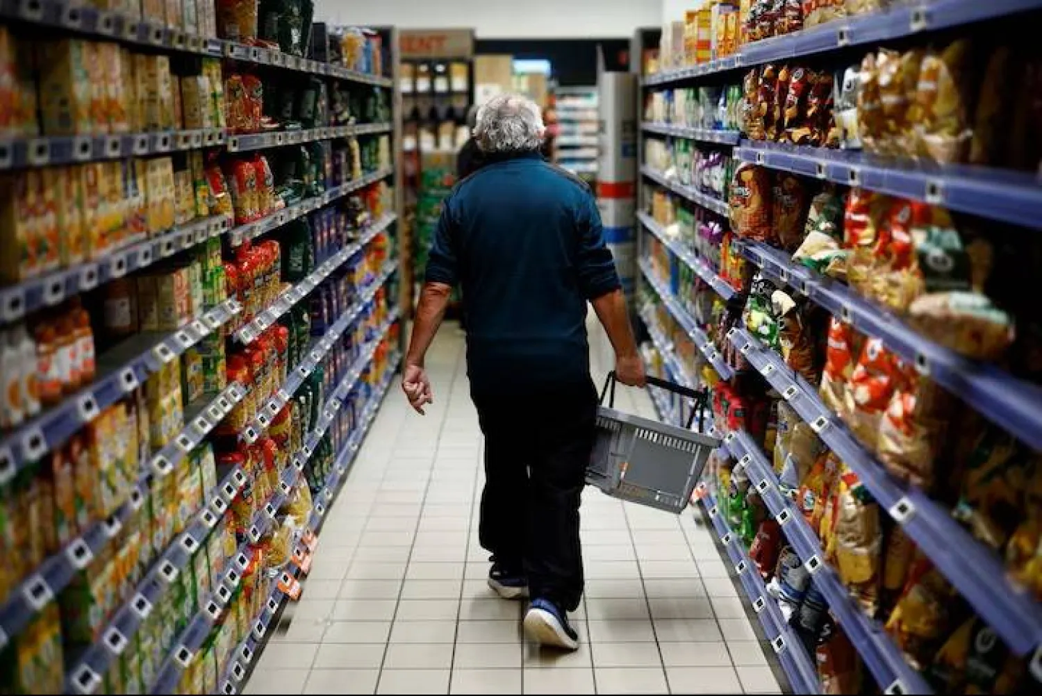 A man shops in a supermarket in Chanverrie, France, October 16, 2024. REUTERS/Stephane Mahe 