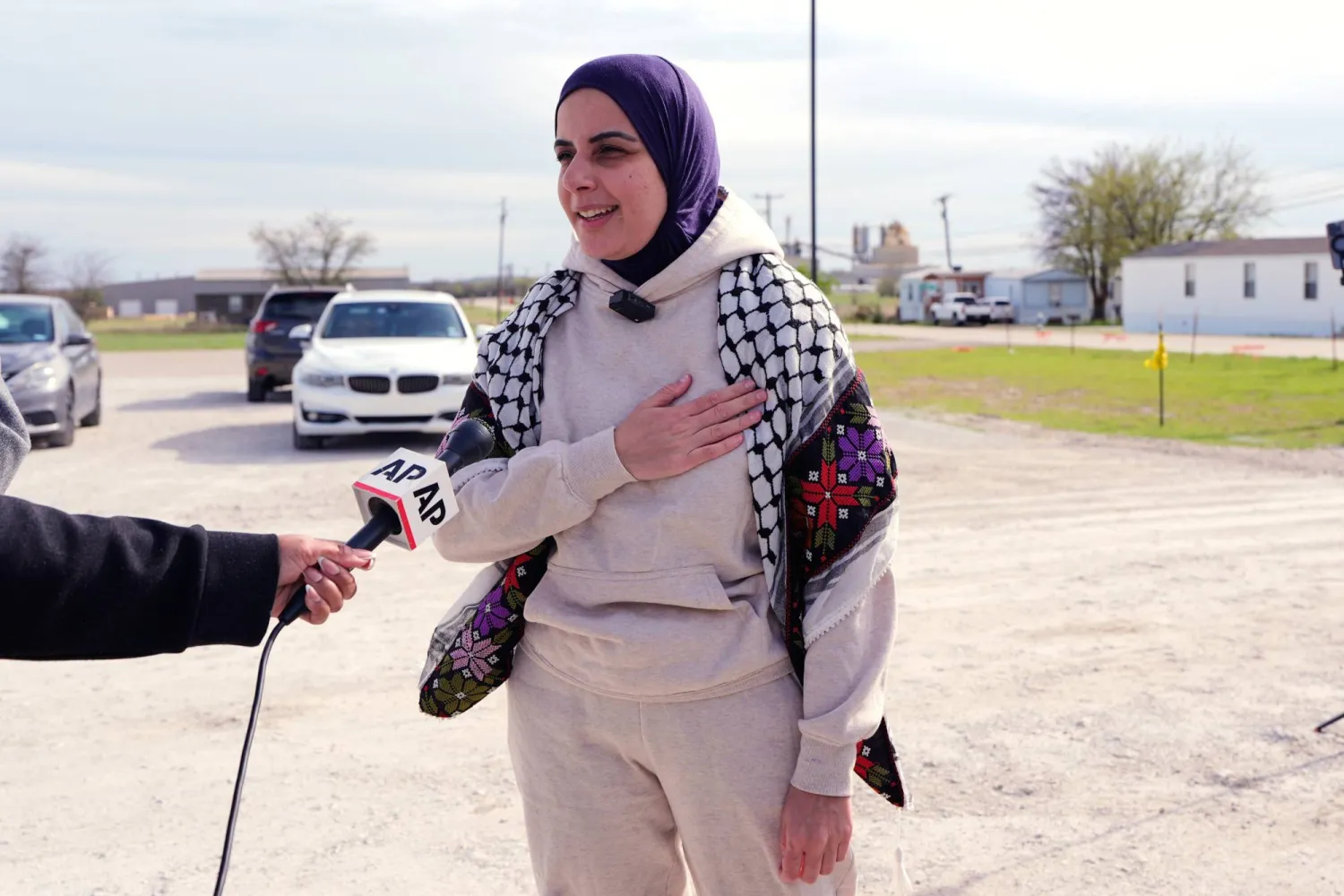 Leqaa Kordia talks to The Associated Press Television News as she stands by friends, family and supporters after being released from the Prairieland Detention Center in Alvarado, Texas, Monday, March 16, 2026. (AP Photo/Tony Gutierrez)
