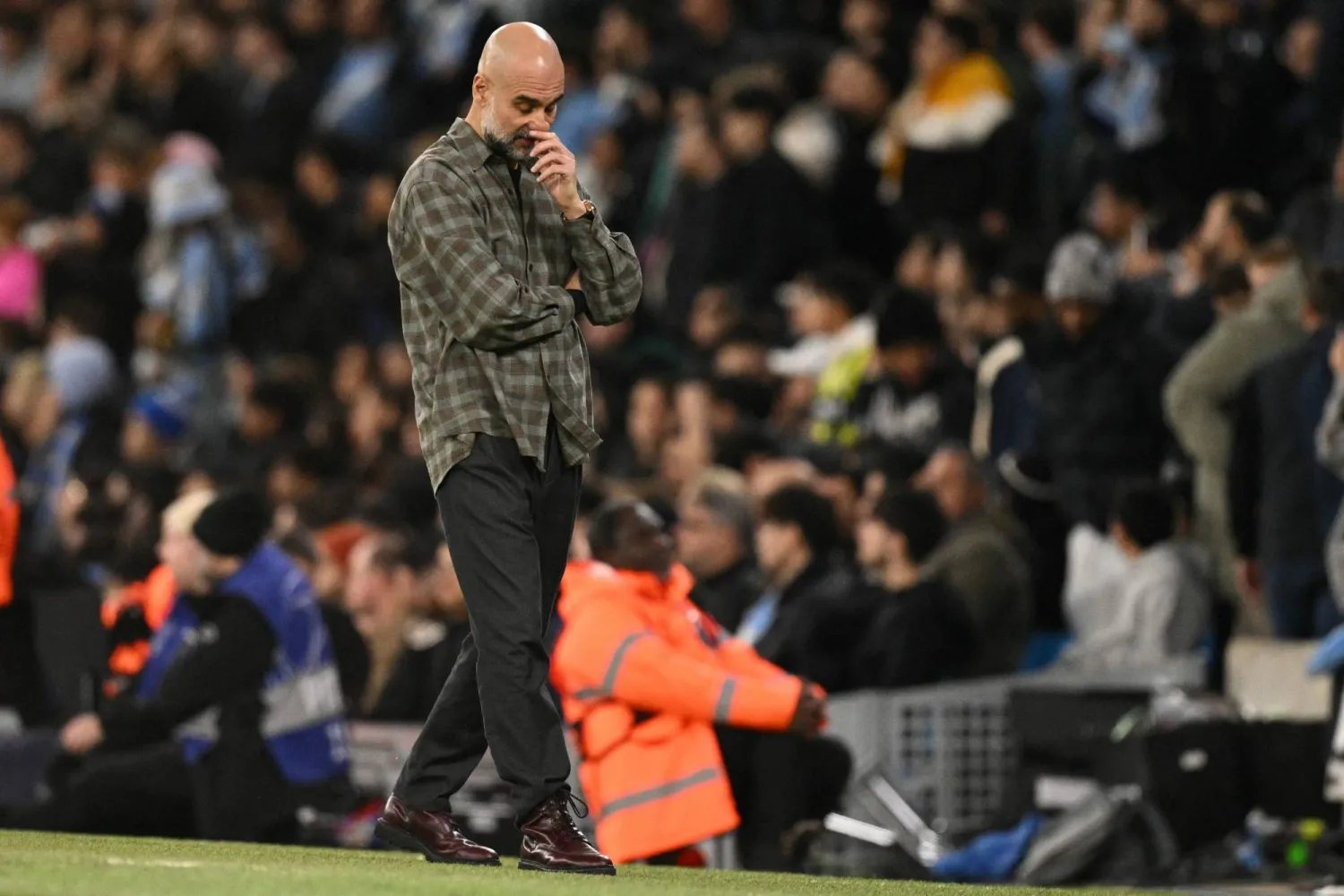 Manchester City's Spanish manager Pep Guardiola reacts on the touchline during the UEFA Champions League, round of 16 second leg football match between Manchester City and Real Madrid at the Etihad Stadium in Manchester, north west England, on March 17, 2026. (Photo by Oli SCARFF / AFP)
