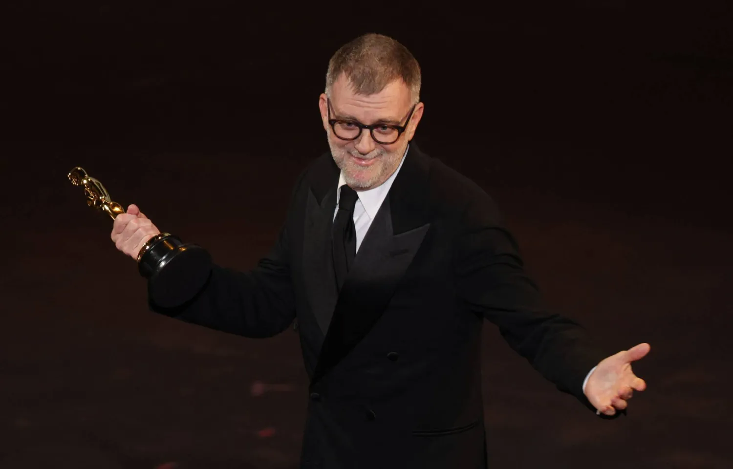 US filmmaker Paul Thomas Anderson accepts the Oscar for Best Writing (Adapted Screenplay) for "One Battle After Another" onstage during the 98th Annual Academy Awards at the Dolby Theater in Hollywood, California on March 15, 2026. (AFP) 