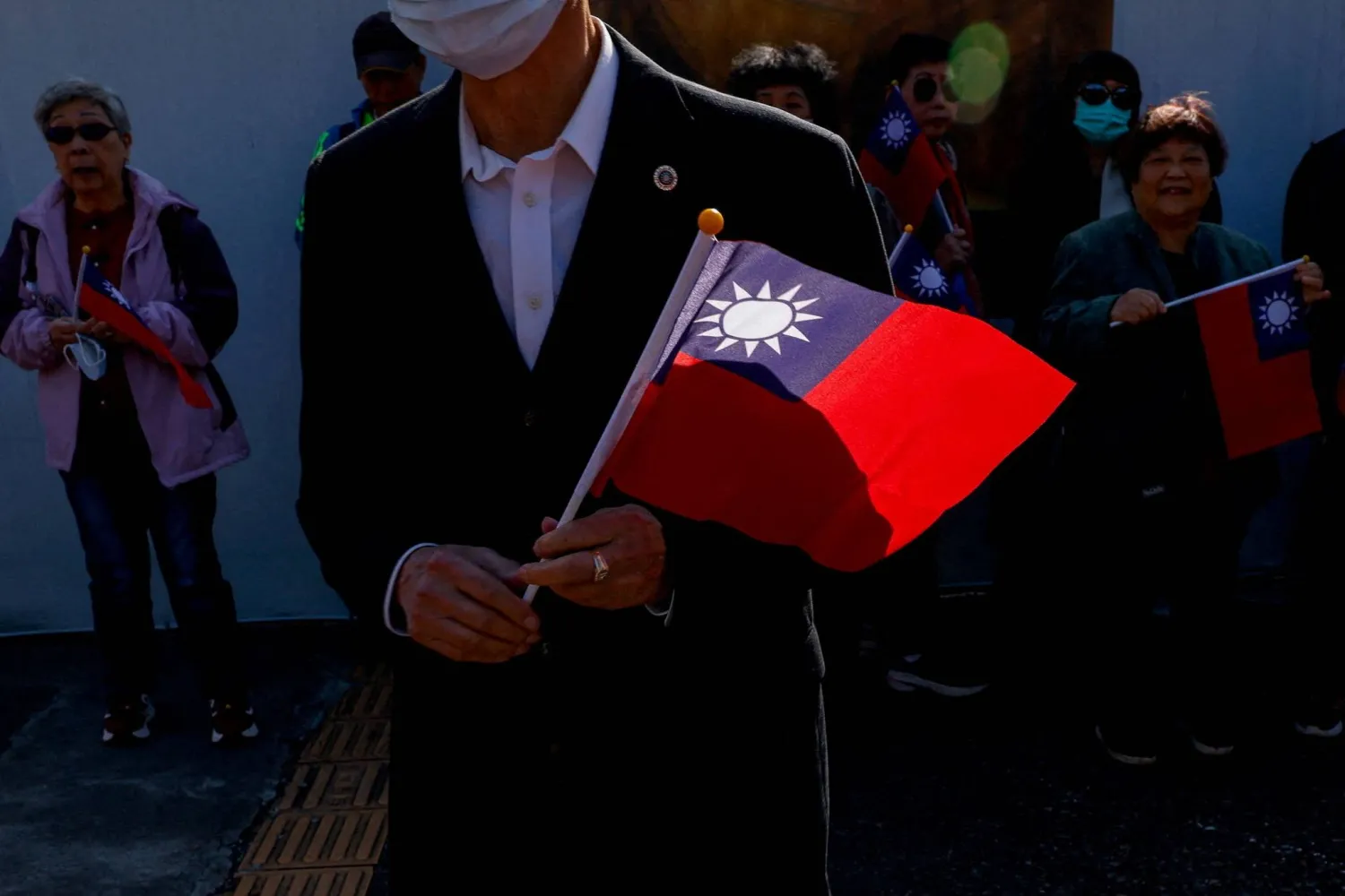 People hold Taiwan flags at an event where Cheng Li-wun, the chairwoman of Taiwan's largest opposition party, the Kuomintang, makes a speech, in Taipei, Taiwan March 12, 2026. (Reuters)