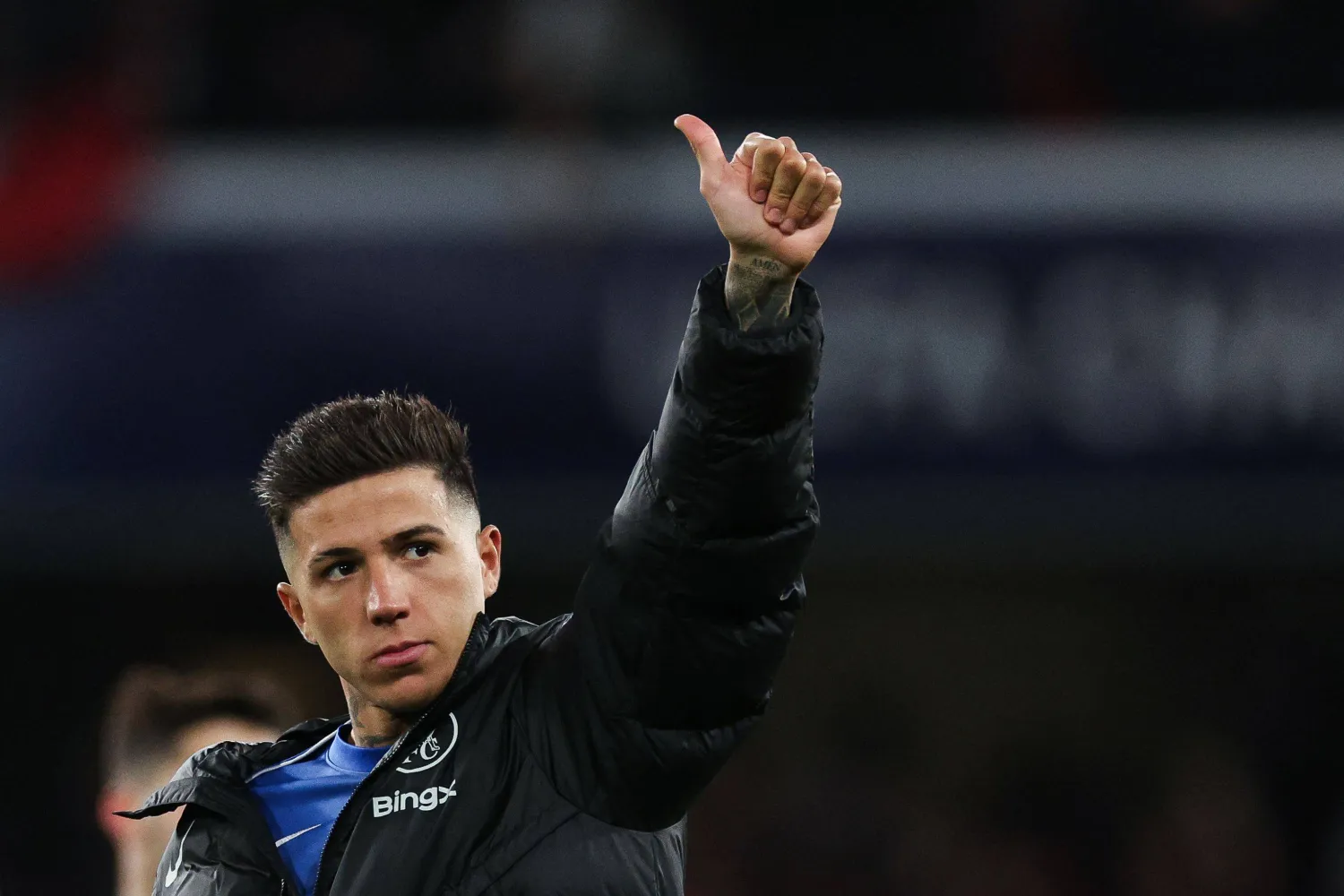 Chelsea's Argentinian midfielder #08 Enzo Fernandez gives a thumb up at the end of the UEFA Champions League round of 16 second leg football match between Chelsea FC and Paris Saint-Germain (PSG) at Stamford Bridge, west London on March 17, 2026. (Photo by Adrian Dennis / AFP)