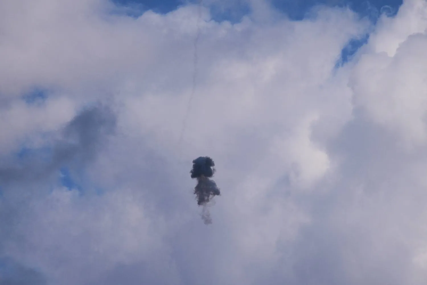Smoke and explosion following an Israeli air defense interception over Kiryat Shmona, northern Israel, on the border with Lebanon, Monday, March 16, 2026. (AP Photo/Ariel Schalit)
