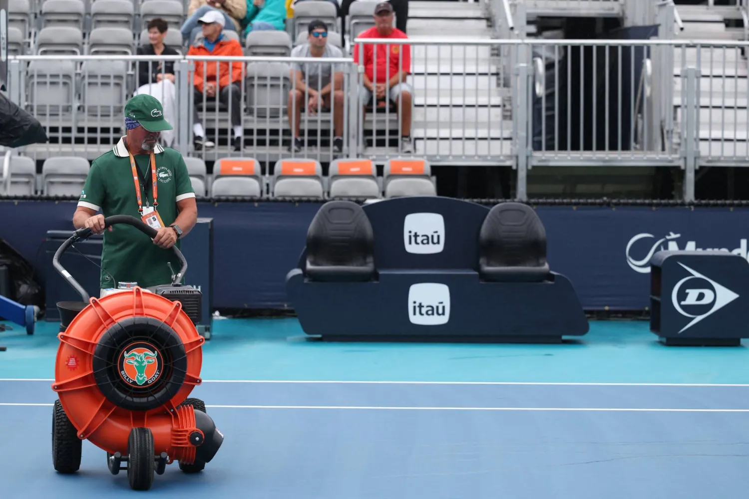 Mar 18, 2026; Miami Gardens, FL, USA; A worker dries Butch Buchholz Court during a rain delay on day 2 of the 2026 Miami Open at Hard Rock Stadium. Mandatory Credit: Geoff Burke-Imagn Images