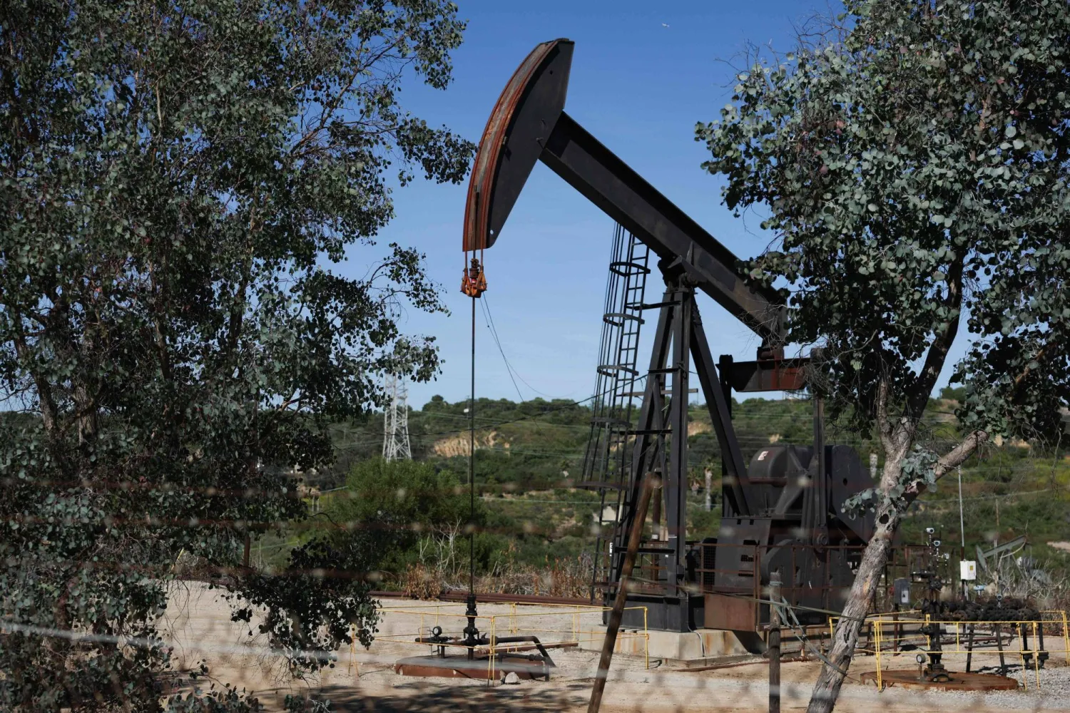 A pumpjack stands at the Inglewood Oil field in Los Angeles, California on March 17, 2026.   (Photo by Patrick T. Fallon / AFP)