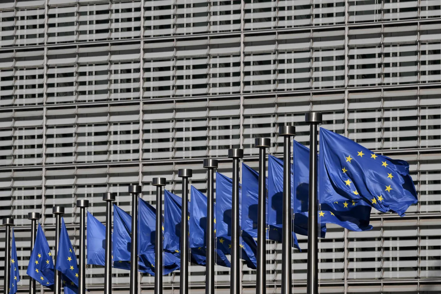  This photograph shows European flags fluttering outside the EU Commission headquarters in Brussels on March 18, 2026. (AFP) 