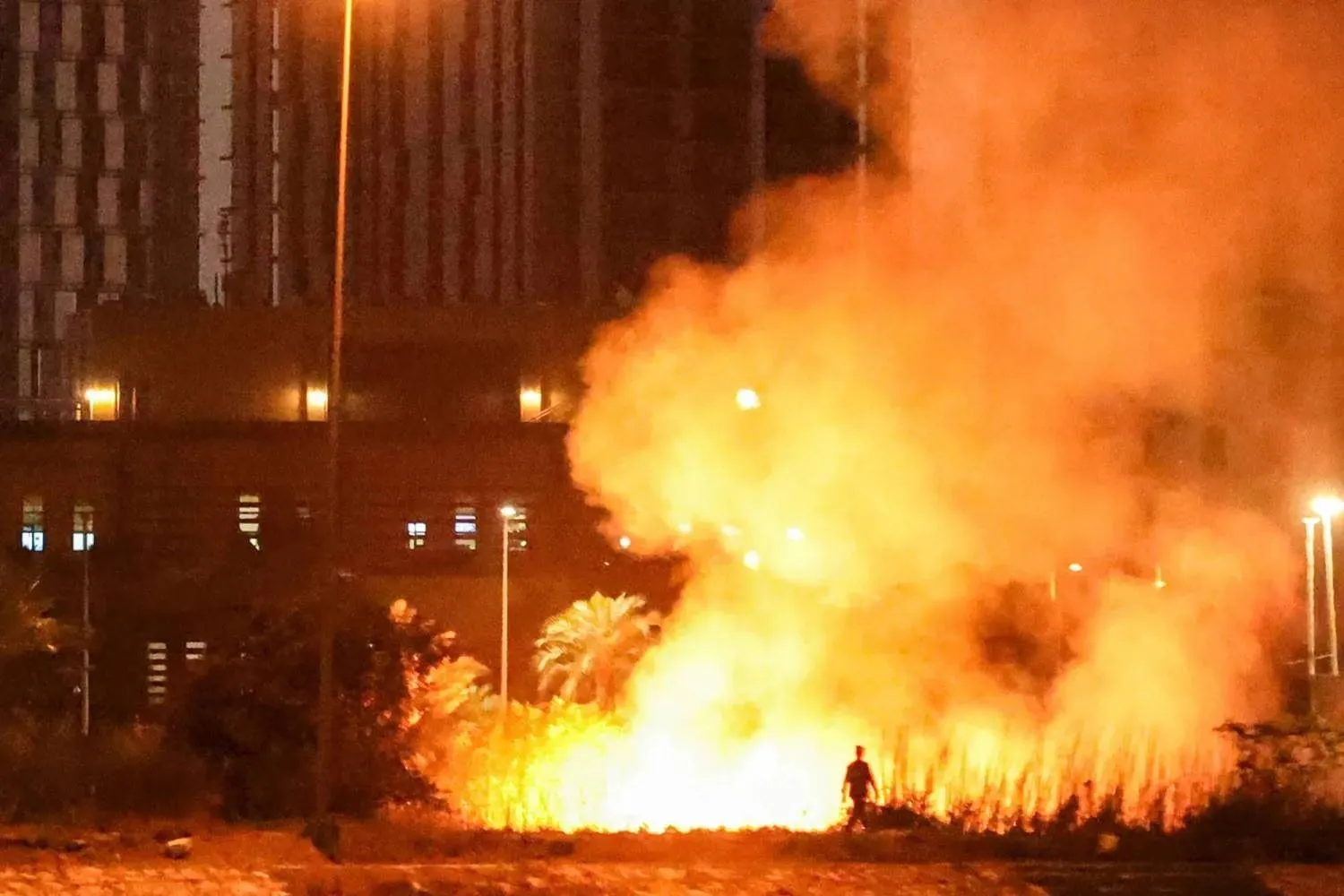 A burning fire outside the perimeter of the United States Embassy in the fortified Green Zone in Baghdad on March 17, 2026. 