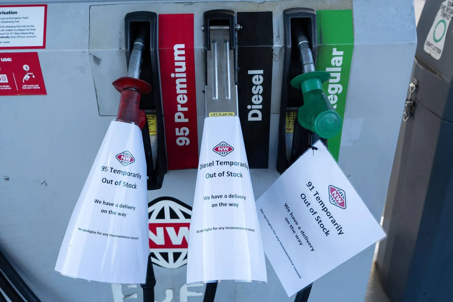 Notes read “Out of Stock” at the New World Fuel station in Levin, New Zealand, on March 19, 2026. (Photo by Marty MELVILLE / AFP)