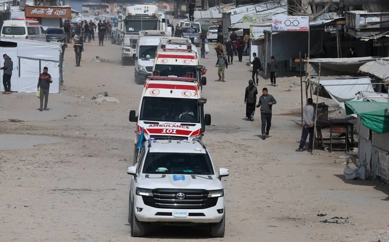 A UN vehicle leads ambulances carrying war-wounded people and patients who leave Gaza, for treatment abroad, through the Rafah border crossing between Gaza and Egypt after it was opened by Israel on Thursday for a limited number of people, in Khan Younis in the southern Gaza Strip, March 19, 2026. (Reuters) 