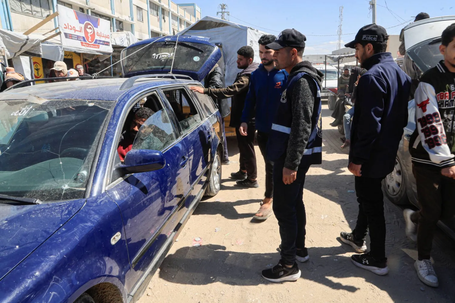  Palestinian policemen inspect a vehicle in Khan Younis in the southern Gaza Strip, March 16, 2026. (Reuters)
