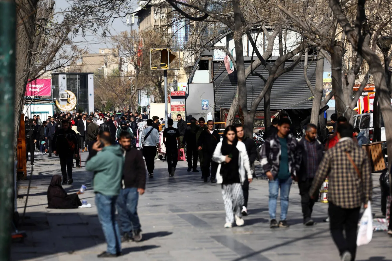 People walk in Tehran Bazaar, ahead of Nowruz, the Iranian New Year, amid the US-Israeli conflict with Iran, in Tehran, Iran, March 18, 2026. Majid Asgaripour/WANA (West Asia News Agency) via REUTERS 
