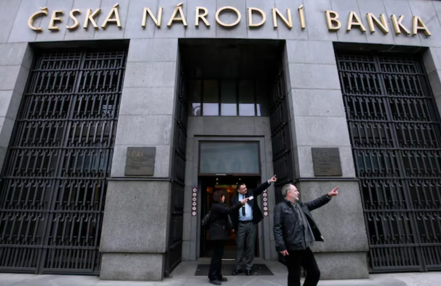 People leave the Czech National Bank building in central Prague December 9, 2011. REUTERS/Petr Josek/File Photo