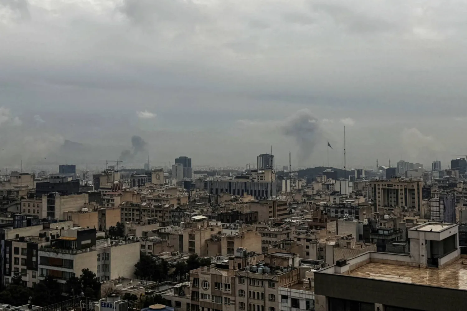 Plumes of smoke rise from the site of a strike in Tehran on March 16, 2026. (AFP)