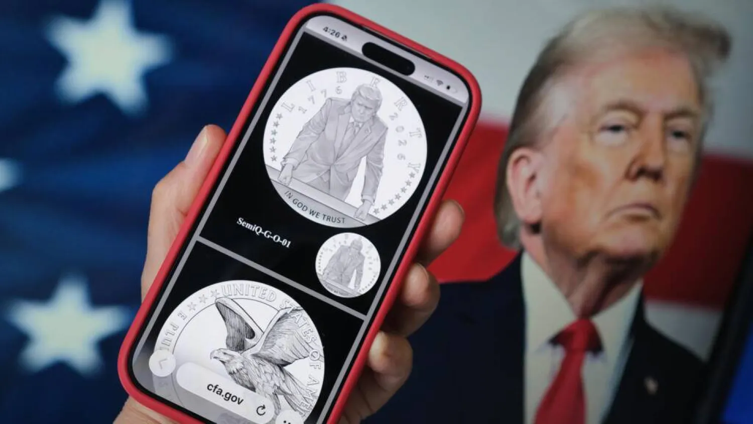 A phone displaying the commemorative gold coin featuring Trump to mark America's 250th anniversary. Chris DELMAS / AFP
