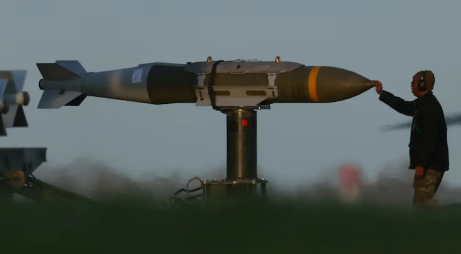 A member of ground crew moves munitions towards a USAF B1 B bomber at RAF Fairford airbase, used by USAF personnel, amid the US–Israeli conflict with Iran, in Fairford, Gloucestershire, Britain, March 11, 2026. REUTERS/Phil Noble