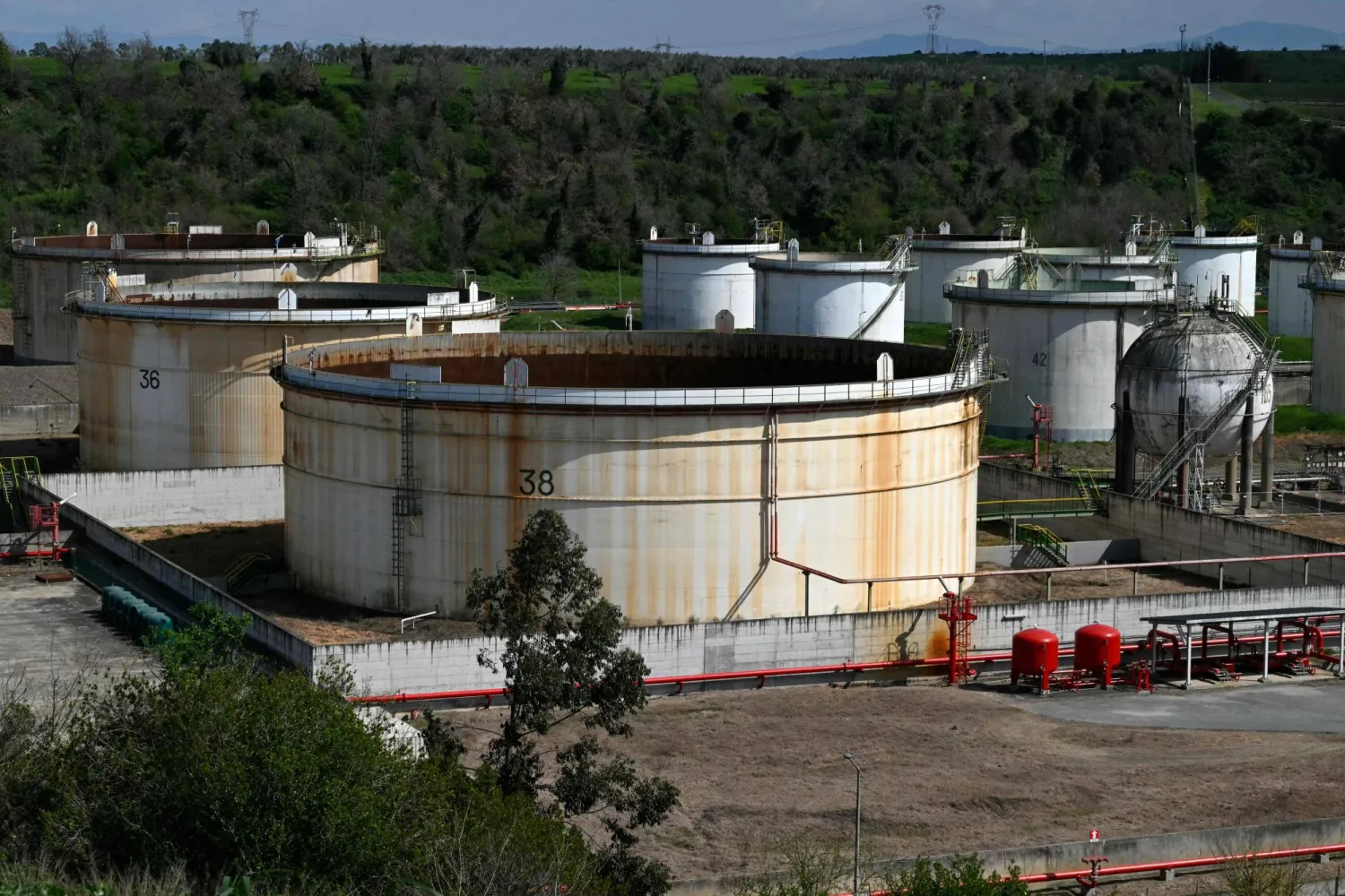 A general view shows cisterns at the deposit of an oil site, in Rome on March 19, 2026. (Photo by Andreas SOLARO / AFP)