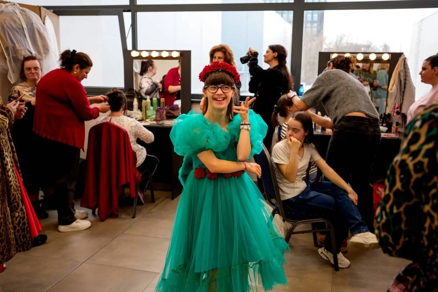 Antonia Voicu laughs before the SEEN Anonymous Seamstresses Gala, an event organised by the Down Plus Bucharest, an NGO supporting youngsters with Down Syndrome and other intellectual disabilities, in Bucharest, Romania, Wednesday, March 18, 2026, ahead of the World Down Syndrome Day, on March 21. (AP)