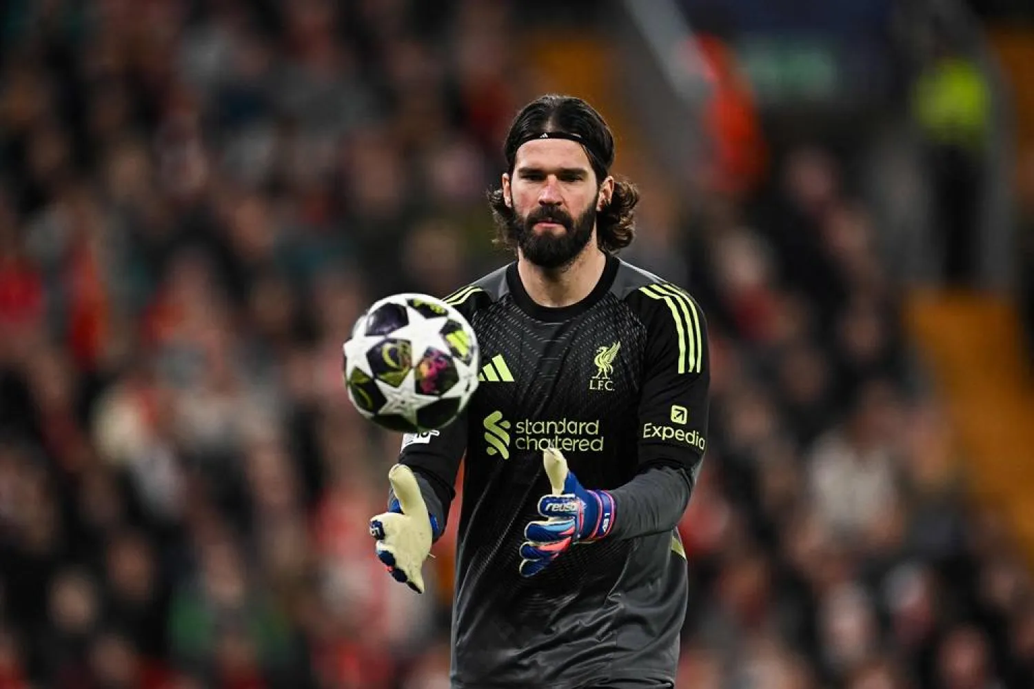 Liverpool's Brazilian goalkeeper #01 Alisson grabs the ball during the UEFA Champions League, round of 16 second leg football match between Liverpool and Galatasaray at Anfield in Liverpool, northwest England on March 18, 2026. (AFP)
