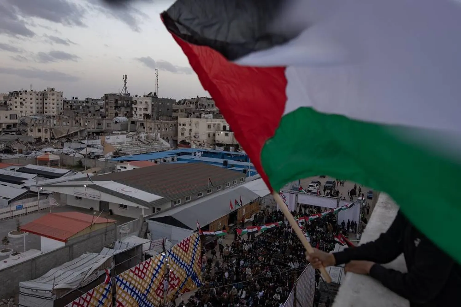 Displaced Palestinians attend Eid al-Fitr prayers amid the rubble of destroyed buildings in Khan Younis in the southern Gaza Strip, 20 March 2026. (EPA)