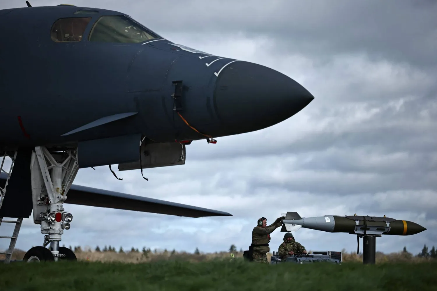 Joint Direct Attack Munitions (JDAMs) are taken from a US Air Force B-1 Lancer bomber at RAF Fairford in south-west England on March 15, 2026. (AFP)