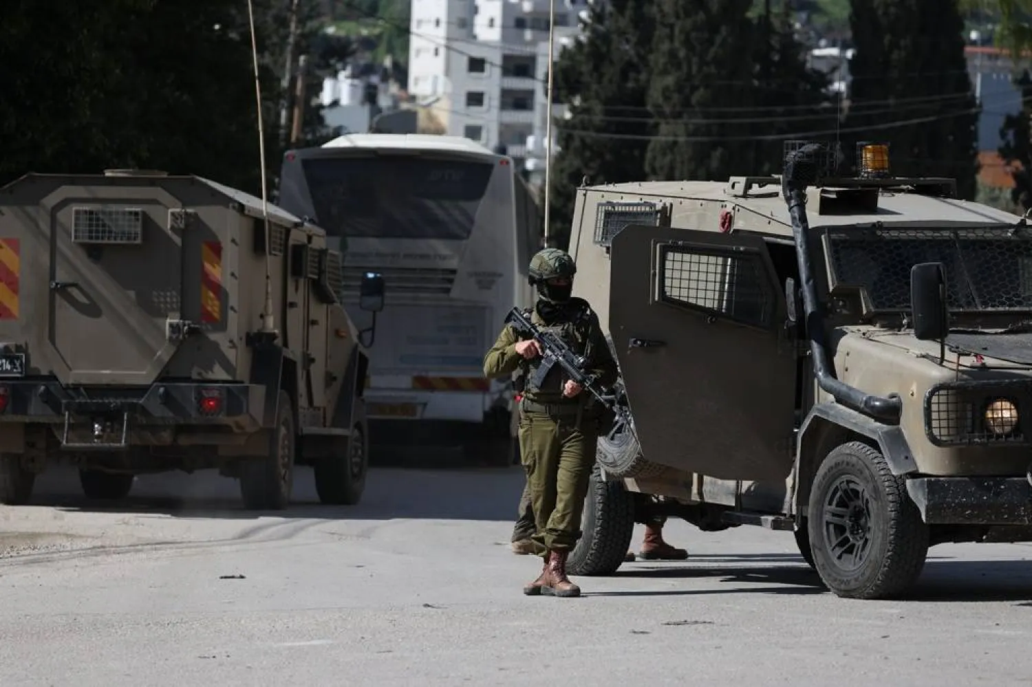 Israeli soldiers take position as Israeli settlers barricade themselves in Joseph's Tomb in Nablus, March 17, 2026. (EPA)