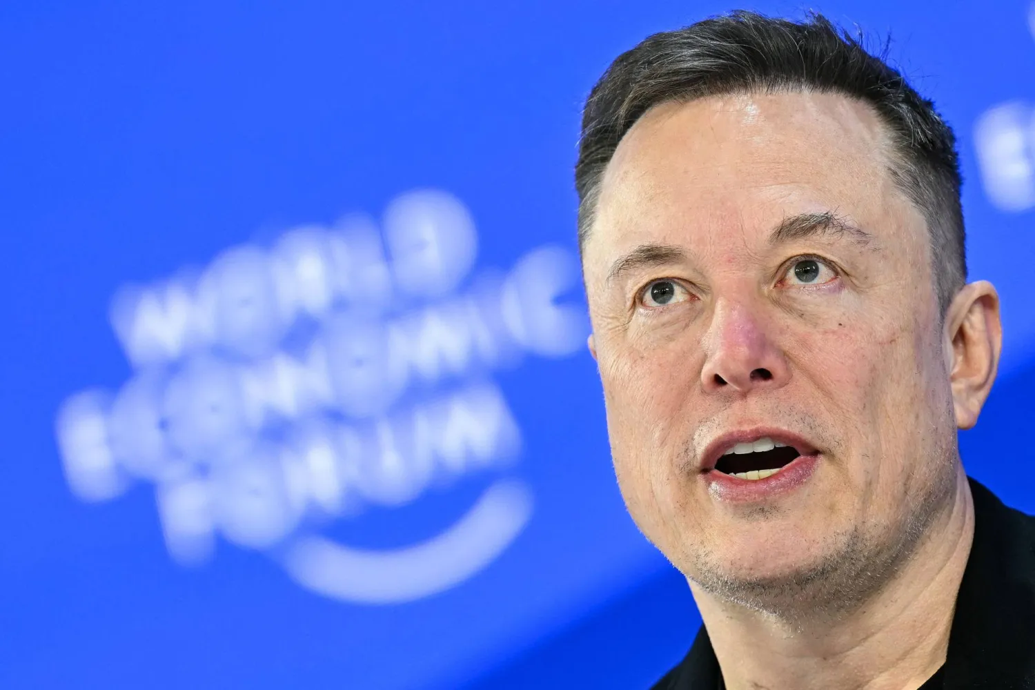 (FILES) CEO of SpaceX and Tesla, South African-Canadian-US businessman Elon Musk speaks during the World Economic Forum (WEF) annual meeting in Davos on January 22, 2026. (Photo by Fabrice COFFRINI / AFP)