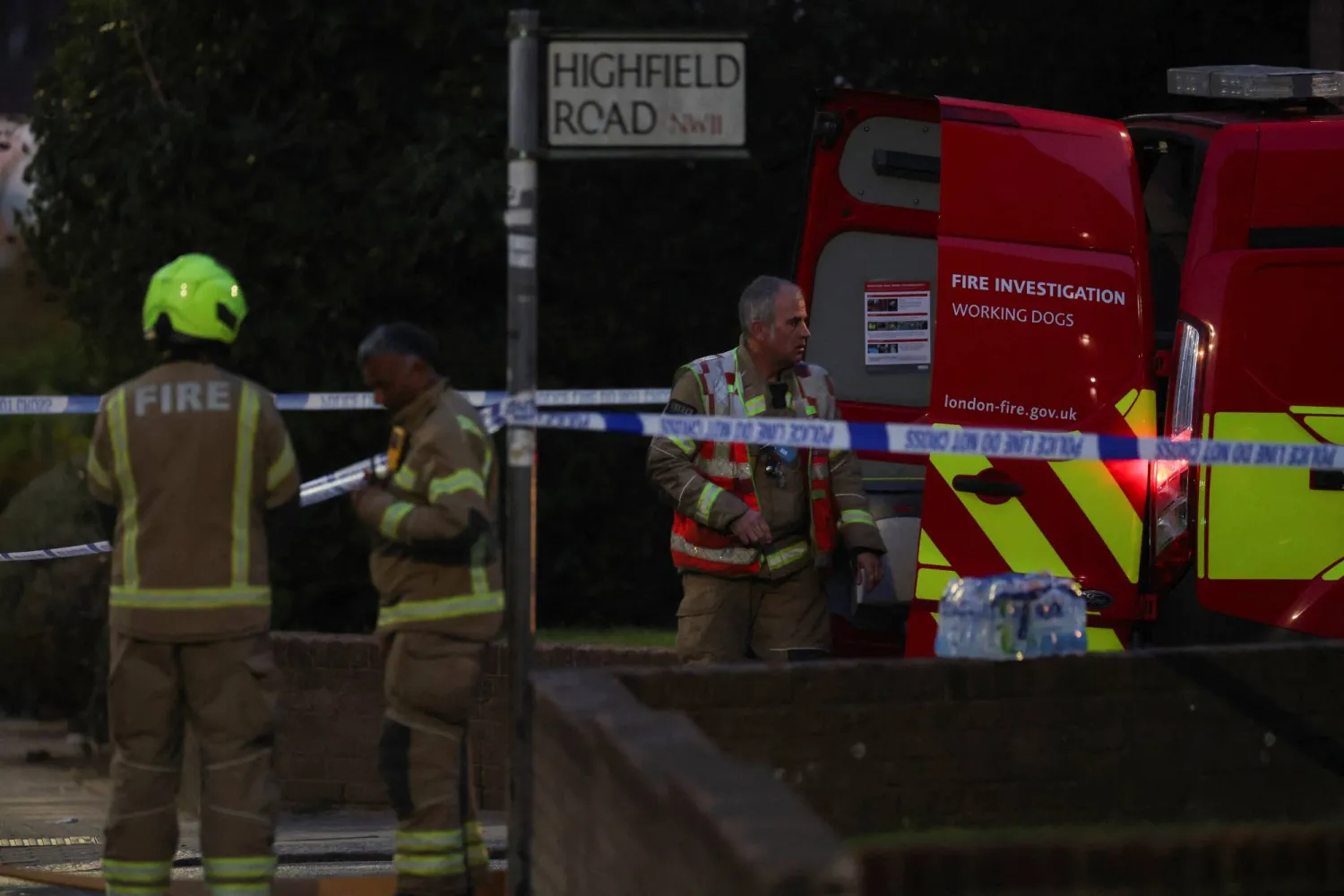 Firefighters work at the scene after four ambulances were set on fire, in northwest London, Britain, March 23, 2026. REUTERS/Hannah McKay