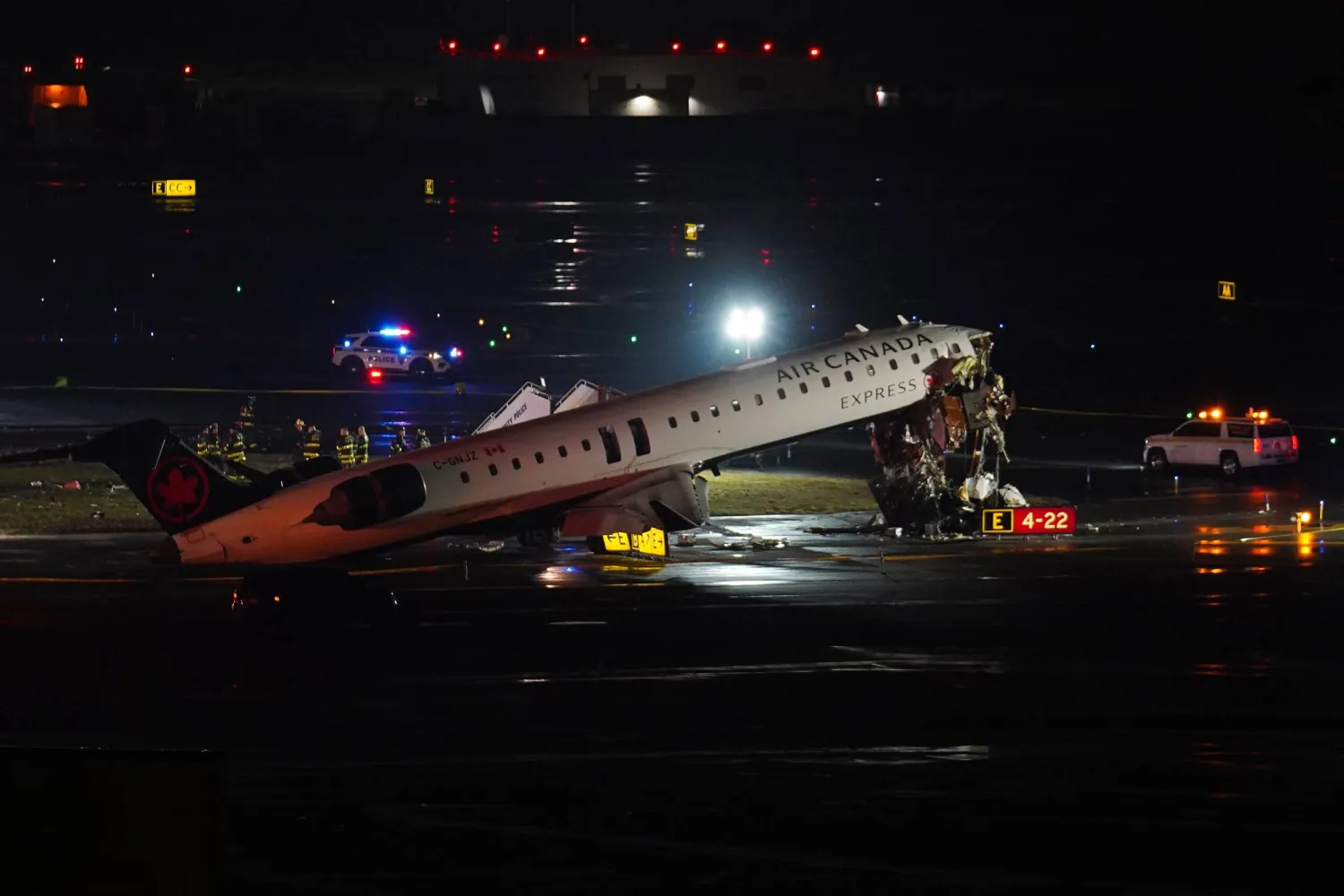 An Air Canada Jet sits on the runway at LaGuardia Airport, Monday, March 23, 2026, after colliding with a Port Authority aircraft rescue and firefighting vehicle in New York. (AP Photo/Ryan Murphy)