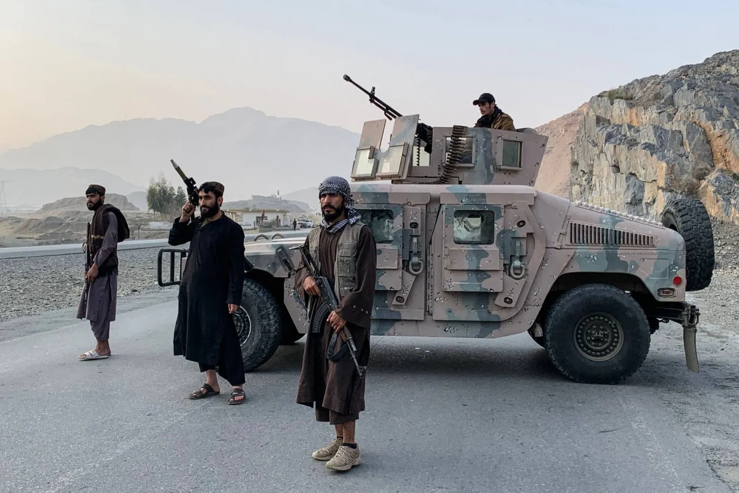 Taliban security personnel guard the Torkham border crossing between Afghanistan and Pakistan in the Afghan province of Nangarhar (AFP)