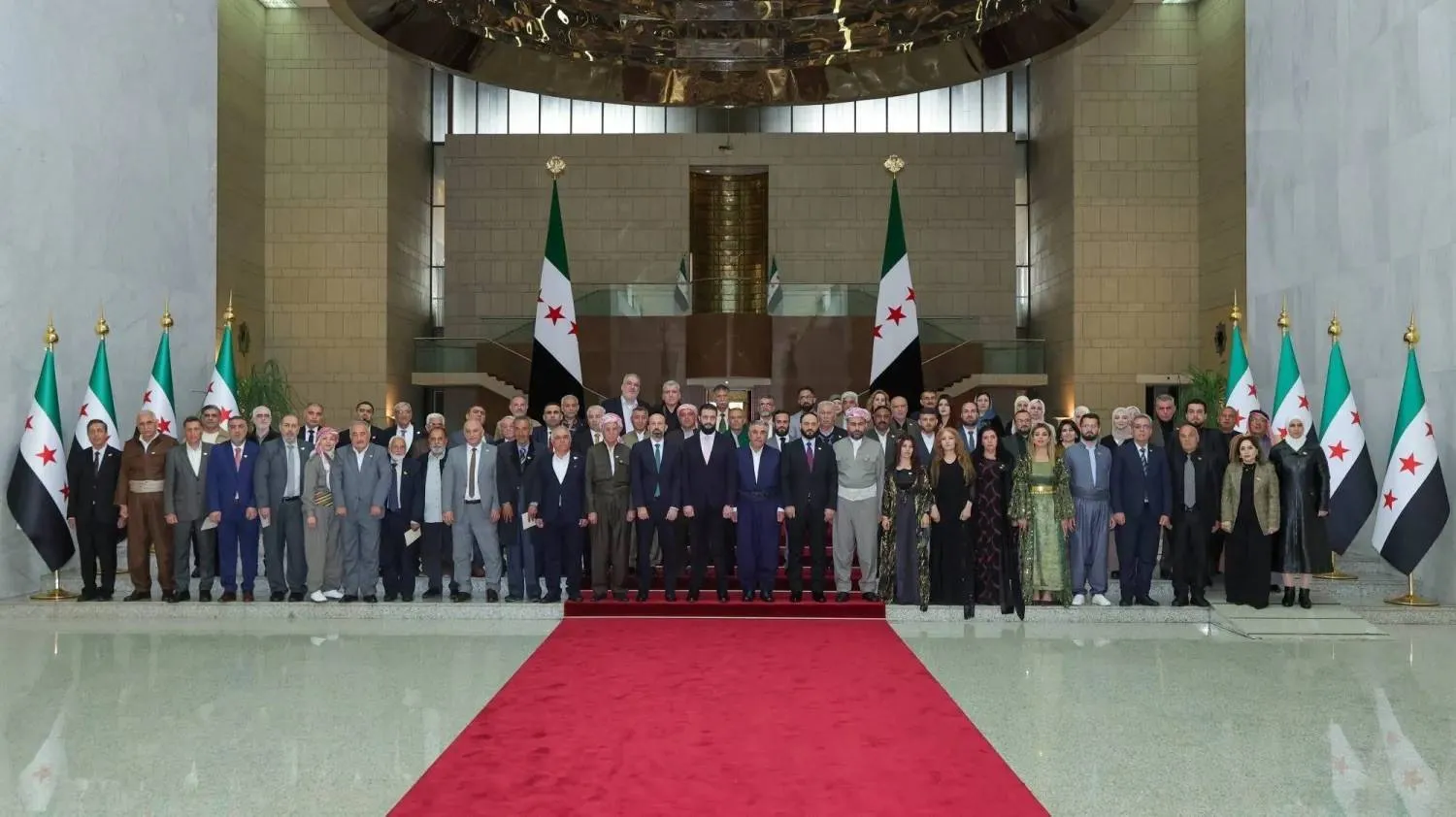 A group photo during Syrian President Ahmed al-Sharaa’s reception in Damascus of a Kurdish delegation marking Eid al-Fitr and Nowruz. (Syrian Presidency) 