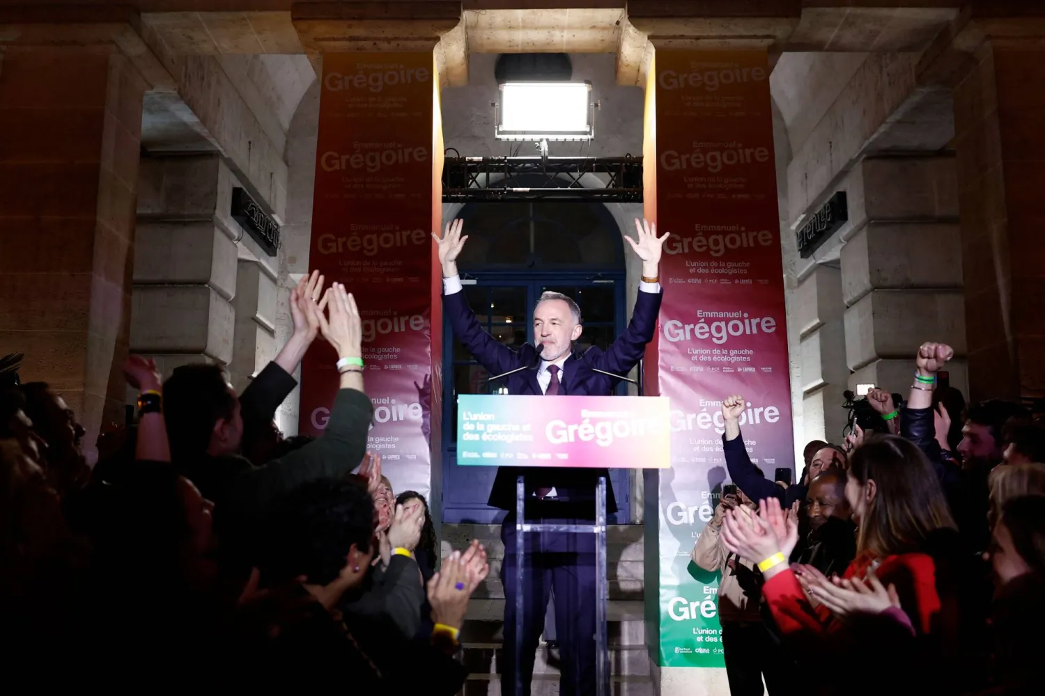 Socialistes et Apparentes' MP and Paris' Mayoral candidate Emmanuel Gregoire (C) celebrates during the party's rally after winning the second round of France's 2026 municipal elections, at the Rotonde Stalingrad in Paris on March 22, 2026. (AFP)