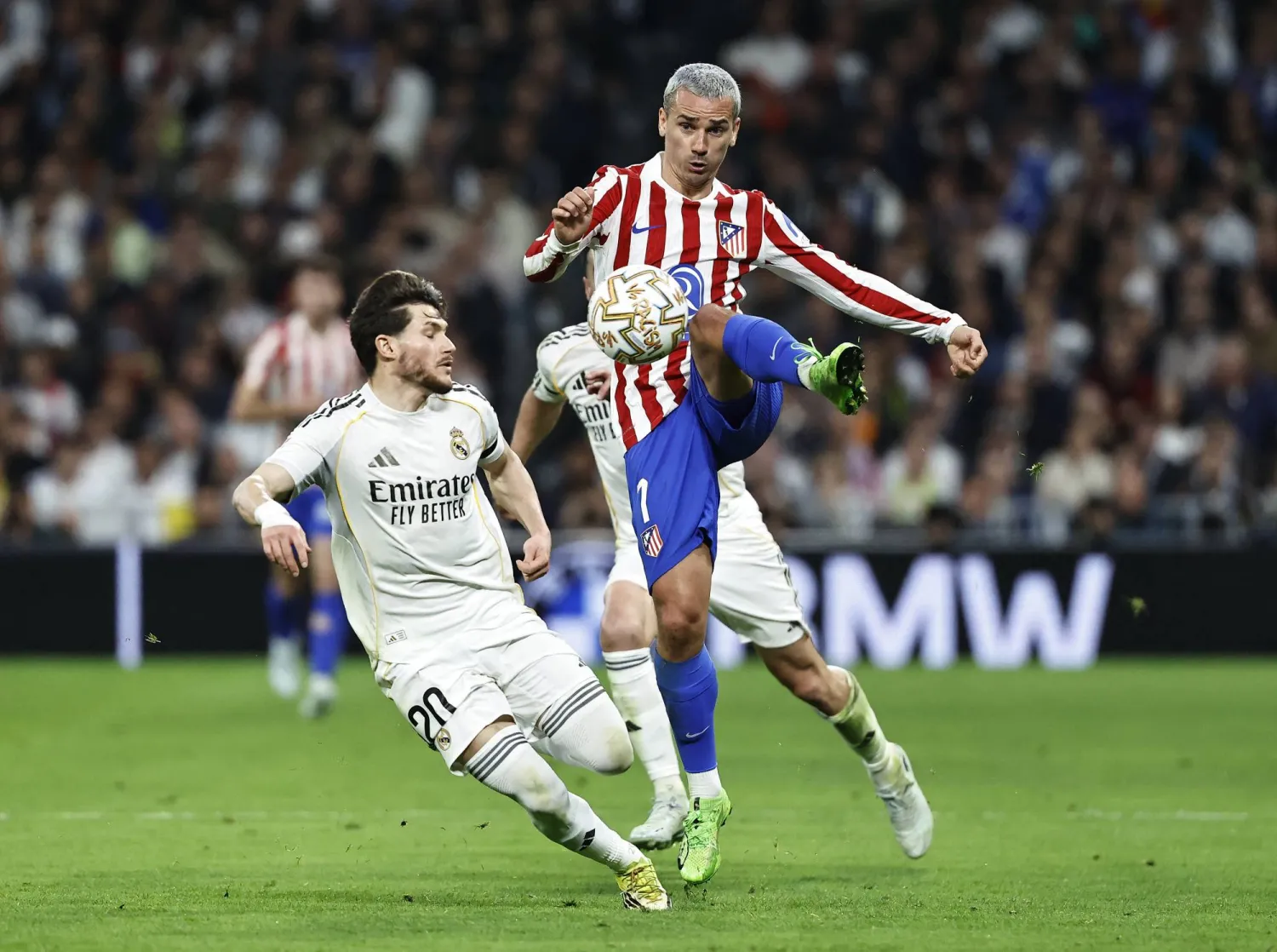 Soccer Football - La Liga - Real Madrid v Atletico Madrid - Santiago Bernabeu, Madrid, Spain - March 22, 2026 Atletico Madrid's Antoine Griezmann in action with Real Madrid's Fran Garcia. (Reuters)