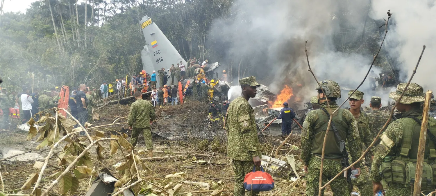 Members of the military gather at the site of a Colombian military plane crash in Puerto Leguizamo, Putumayo, Colombia March 23, 2026. La Voz de Amazonia/Mare Rafue/Handout via REUTERS 