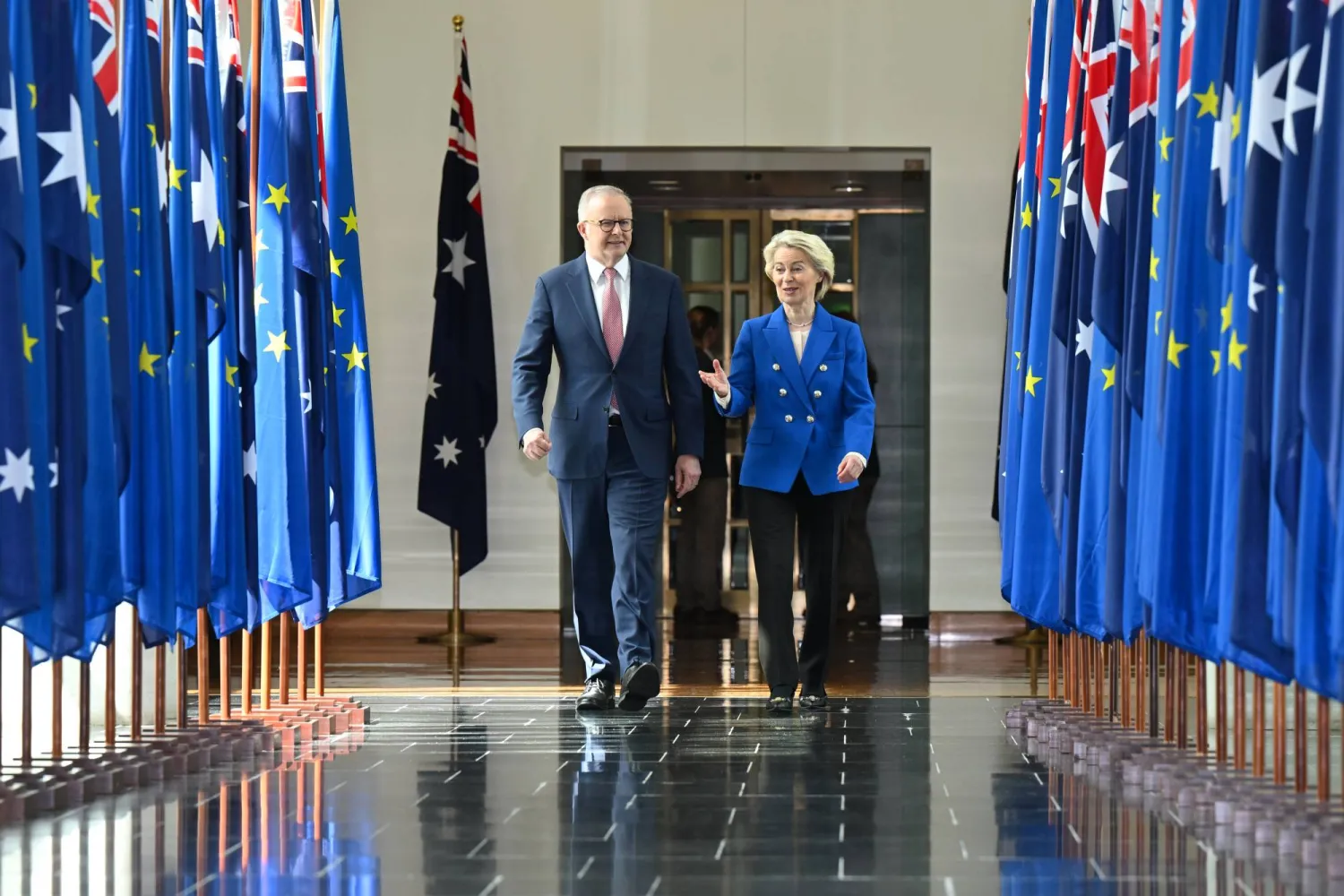 24 March 2026, Australia, Canberra: Australian Prime Minister Anthony Albanese and EU Commission President Ursula von der Leyen walk together after an address to Members and Senators during a joint sitting in the House of Representatives at the Parliament House in Canberra. Photo: Lukas Coch/AAP/dpa