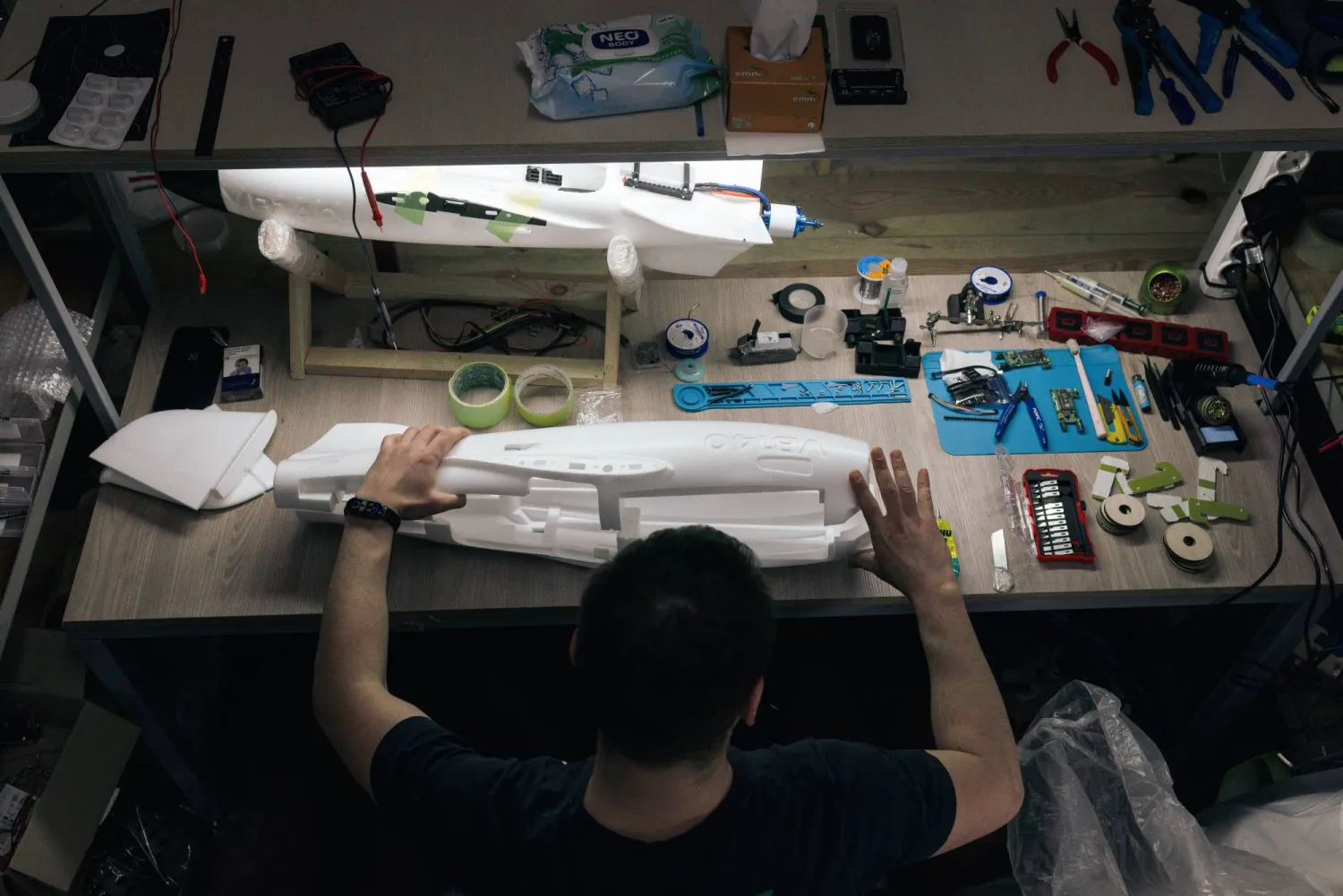 A soldier of the 127th Separate Territorial Brigade mounts a drone at a workshop on the front line in the Kharkiv region Friday, March 13, 2026. (AP Photo/Nikoletta Stoyanova)