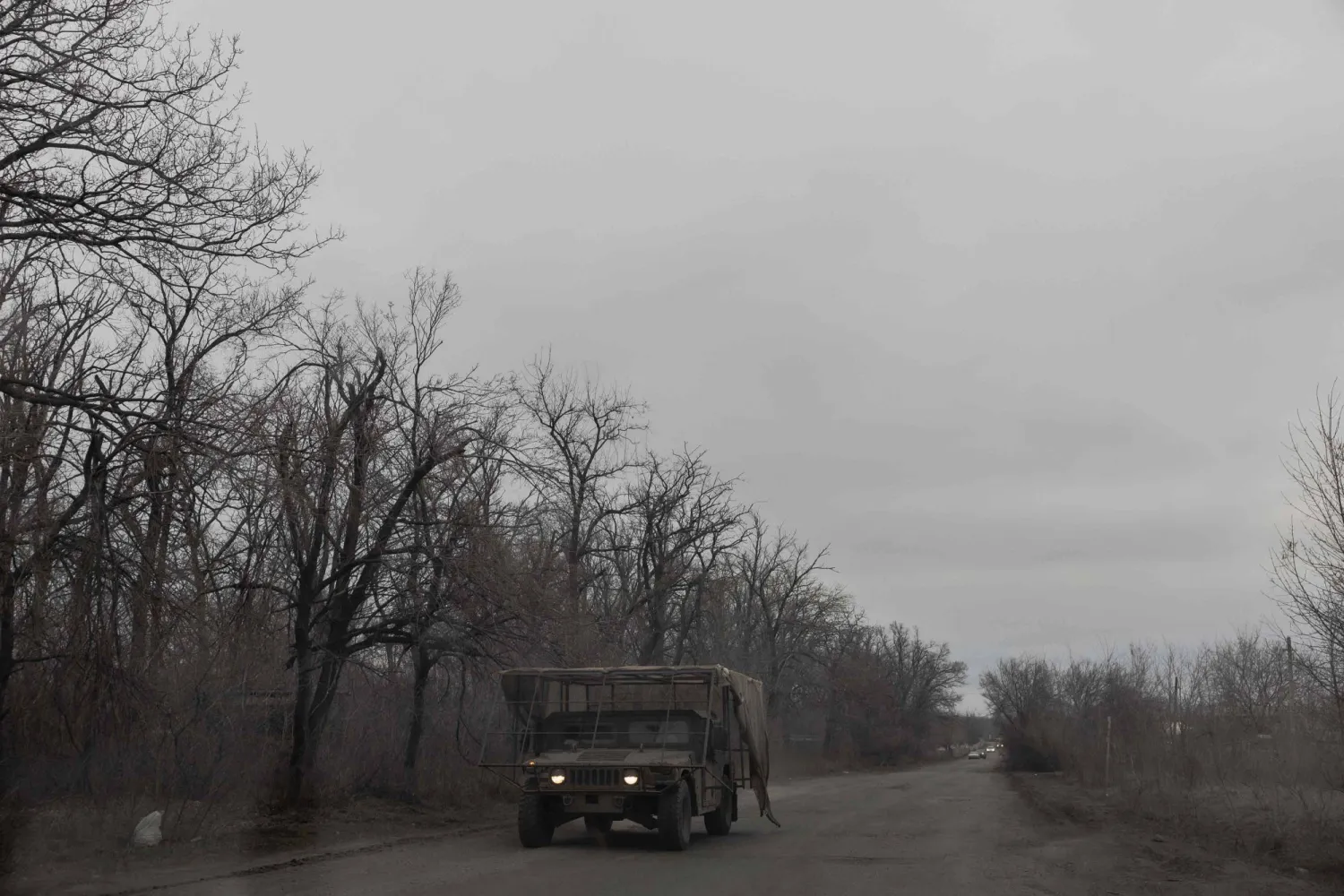 A US-made Humvee driven by a Ukrainian serviceman equipped with additional anti-drone protection drives on a road in the Kharkiv region on March 17, 2026, amid the Russian invasion of Ukraine. (AFP) 