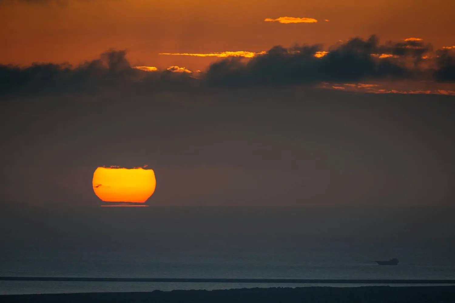 A fishing boat sails as the sun sets in the Arabian Gulf in the United Arab Emirates Monday, March 23, 2026. (AP Photo)