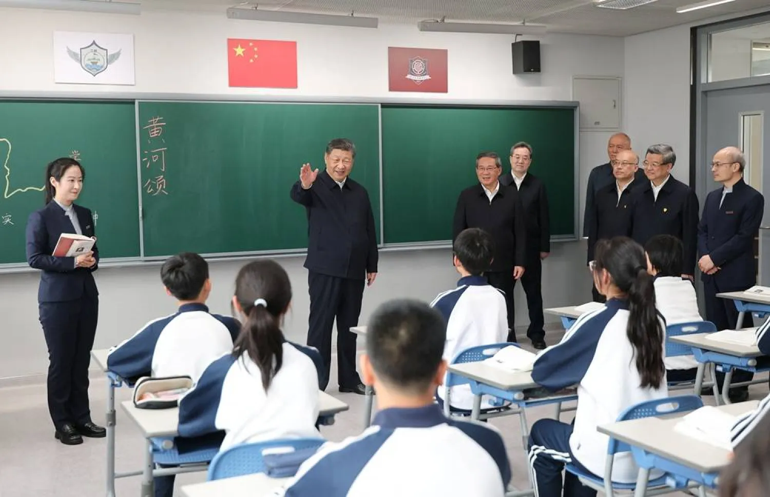  Chinese President Xi Jinping talks with students in a classroom at a high school, during an inspection tour of Xiongan New Area in Hebei province, China March 23, 2026. (cnsphoto via Reuters)