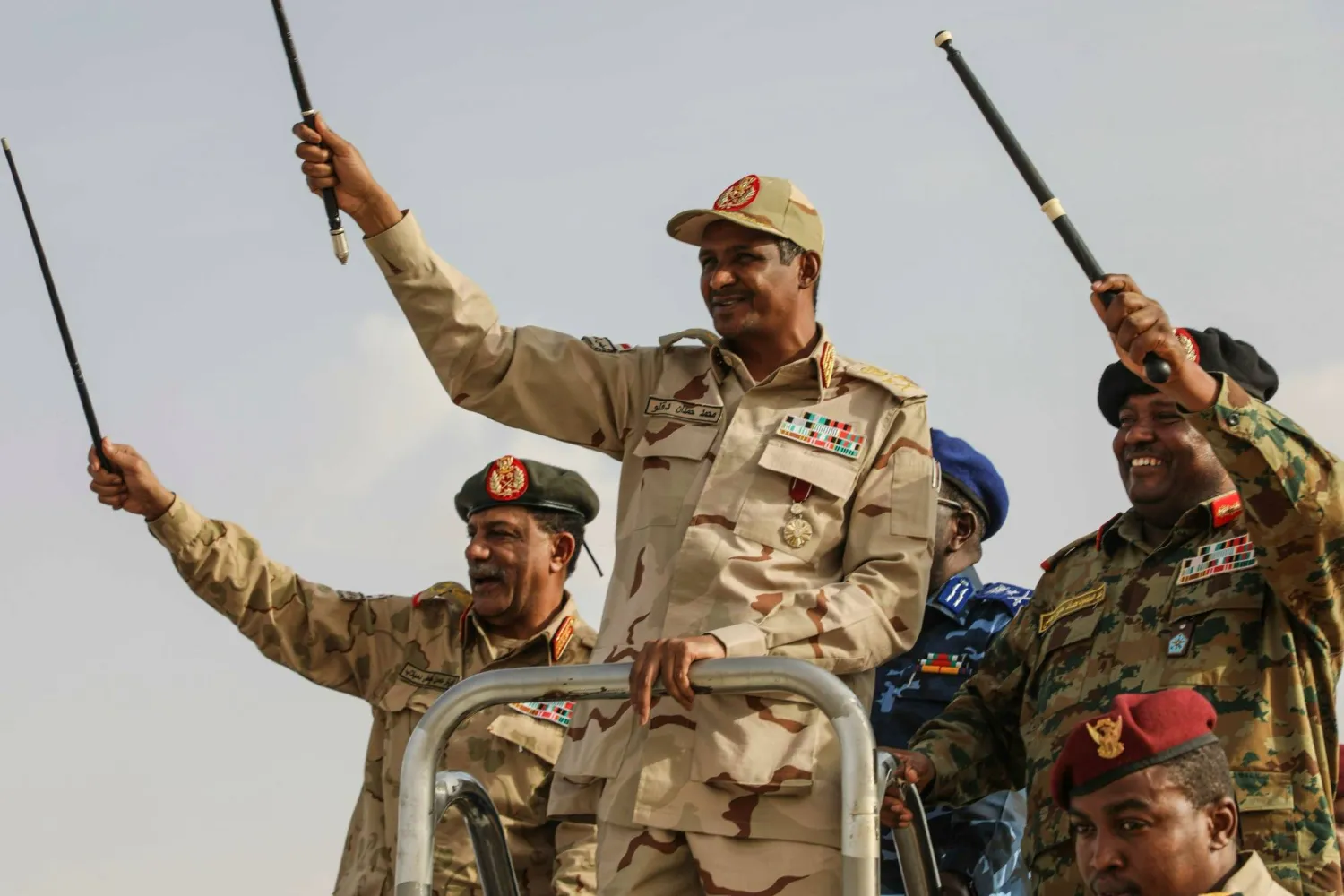 RSF commander Gen. Mohammed Hamdan Dagalo, center, greets the crowd during a military-backed tribes' rally in the Nile River State of Sudan, July 13, 2019. (AP)