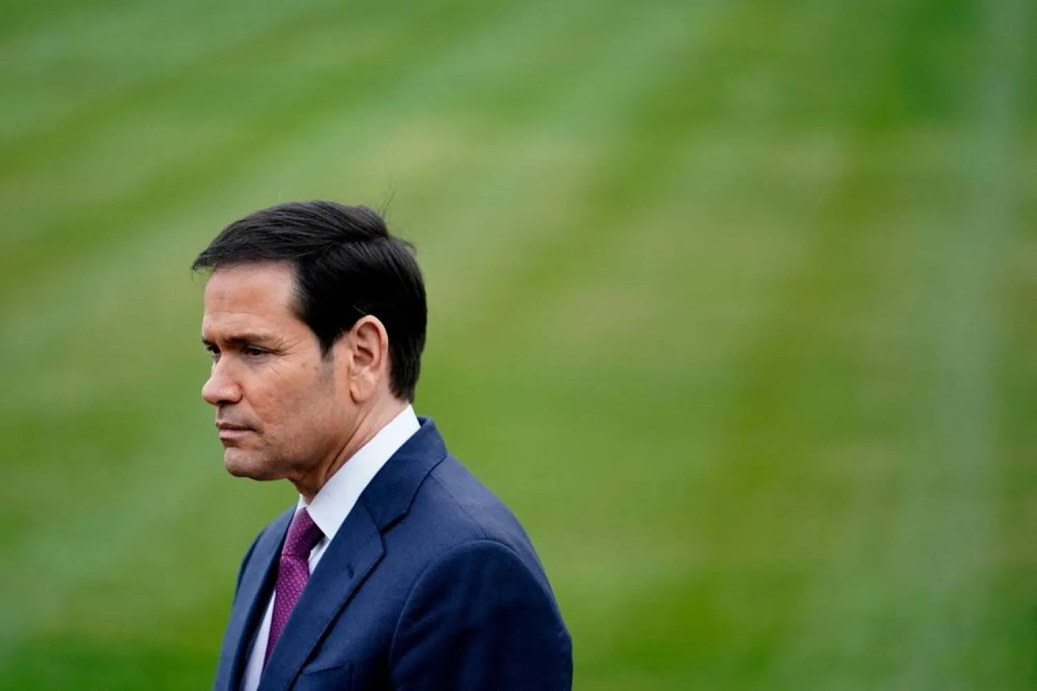 US Secretary of State Marco Rubio listens to US President Donald Trump (not pictured) speaking to the media, as Trump departs the White House for Florida, in Washington, DC, US, March 20, 2026. (Reuters)