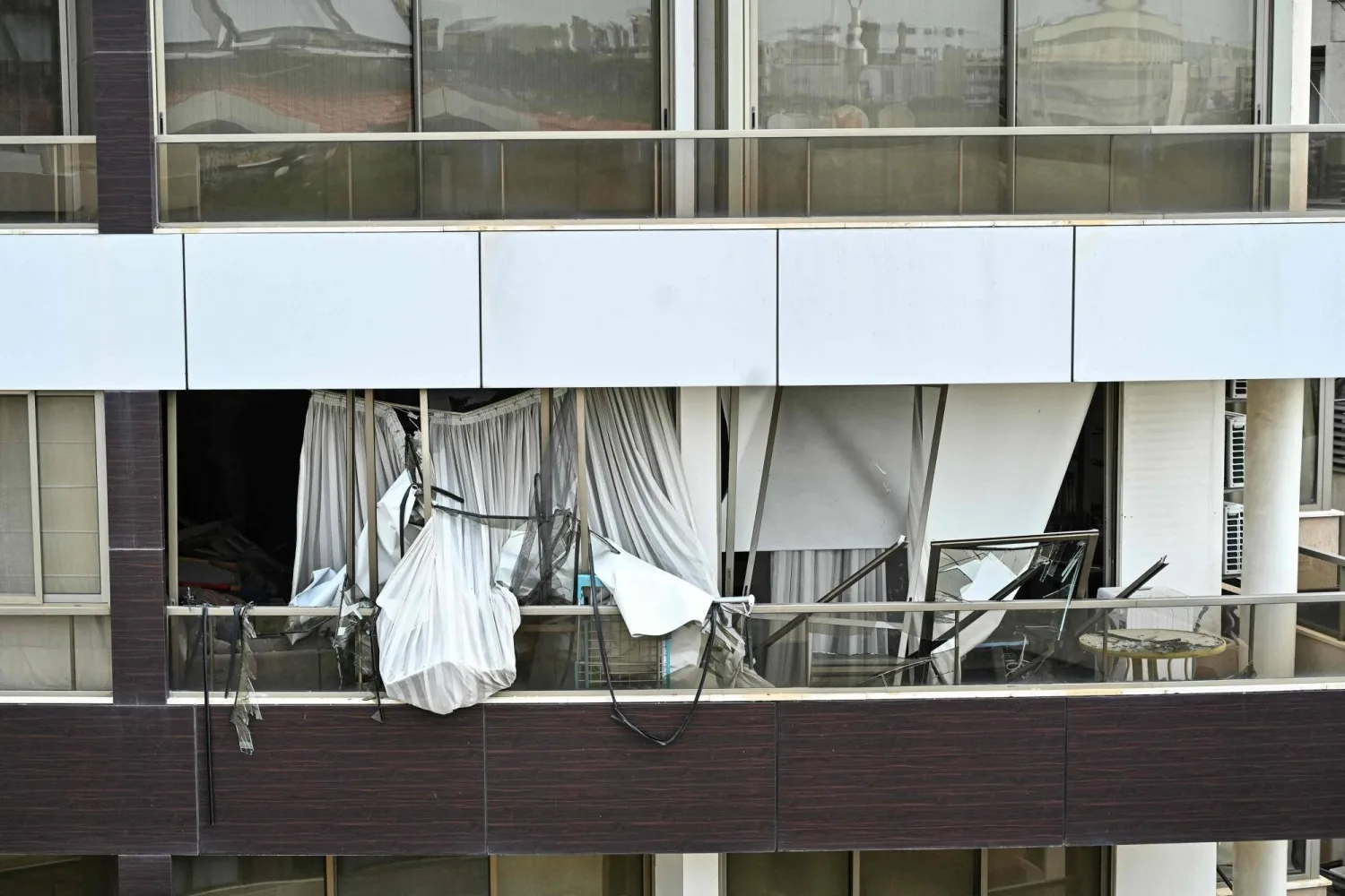 A photograph shows the damage after an Israeli strike targeted an apartment in Hazmieh, on the eastern outskirts of Beirut, on March 23, 2026. (AFP)