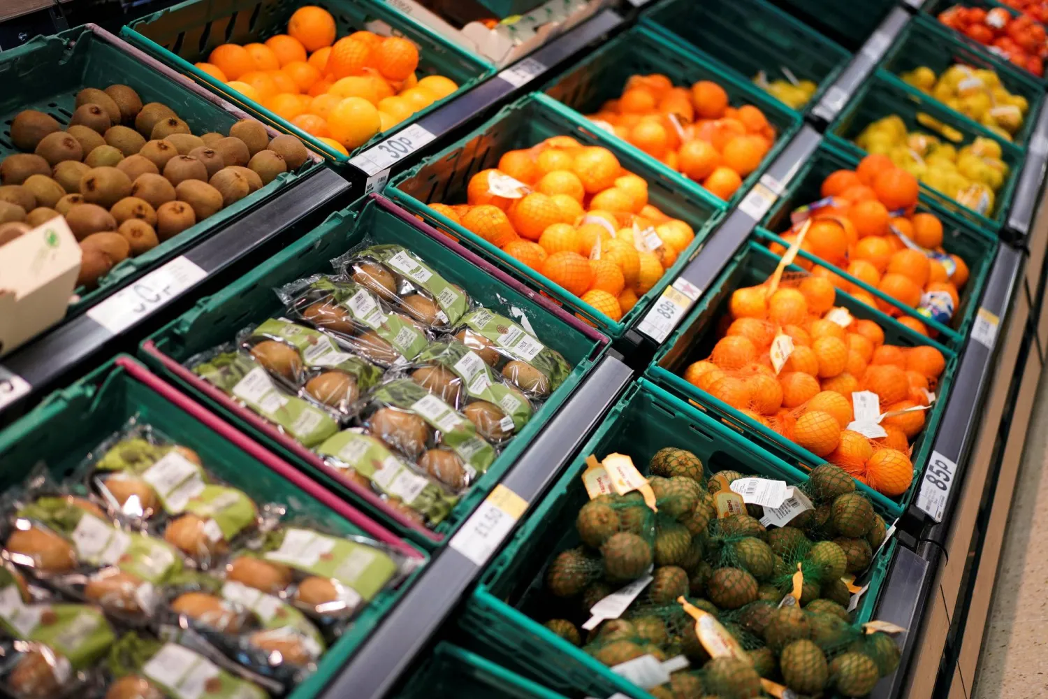 Fruit is displayed for sale inside a supermarket in London (Reuters)