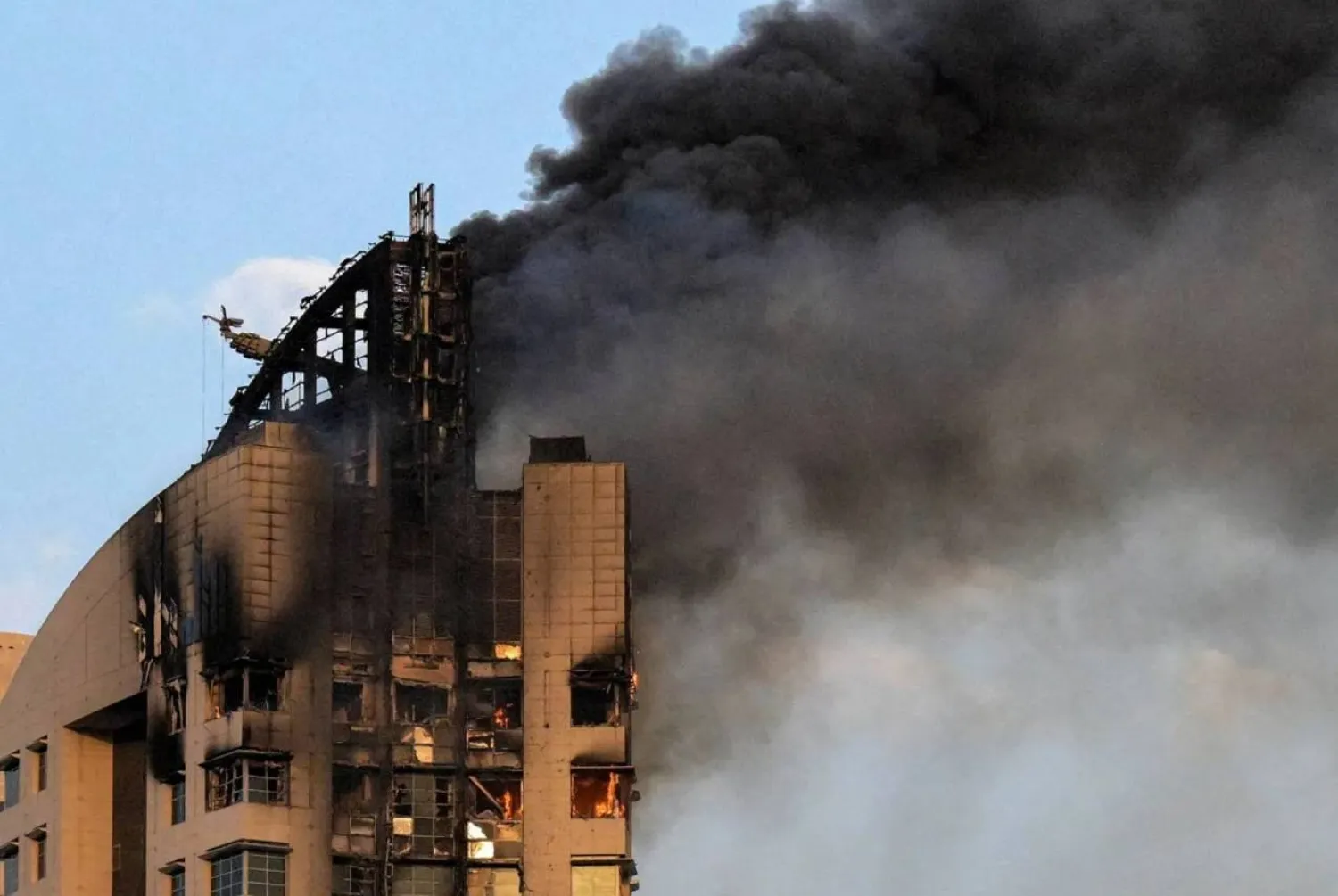 Smoke rises from a high-rise building following a drone attack in Kuwait City on March 8, 2026. (AFP/file photo)